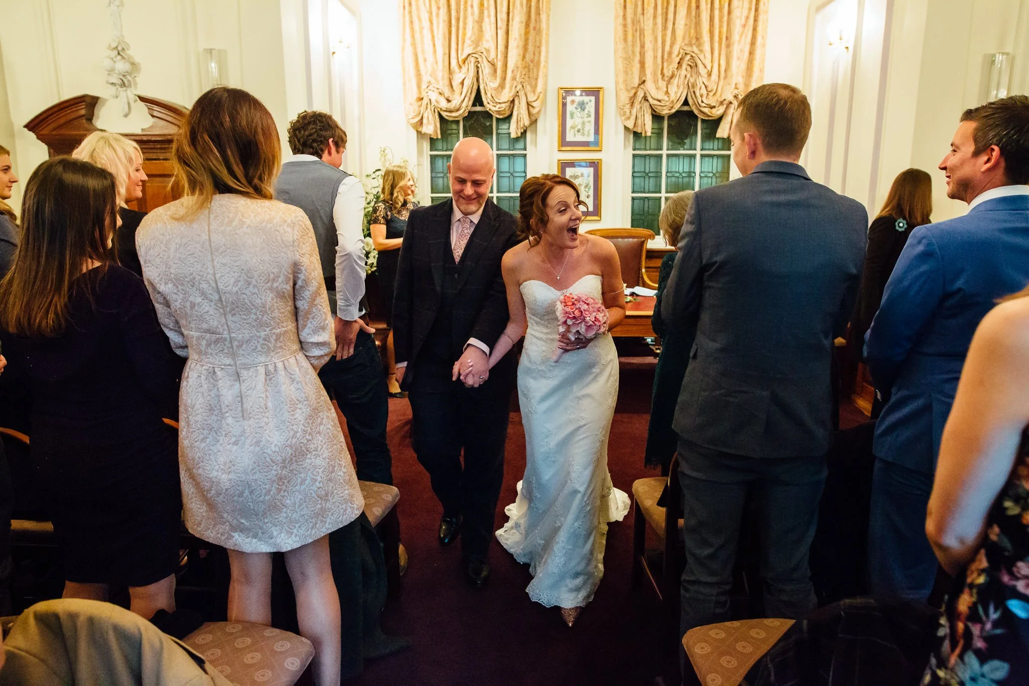  Bride and Groom walk down the aisle after being married at Oxford Register Office 