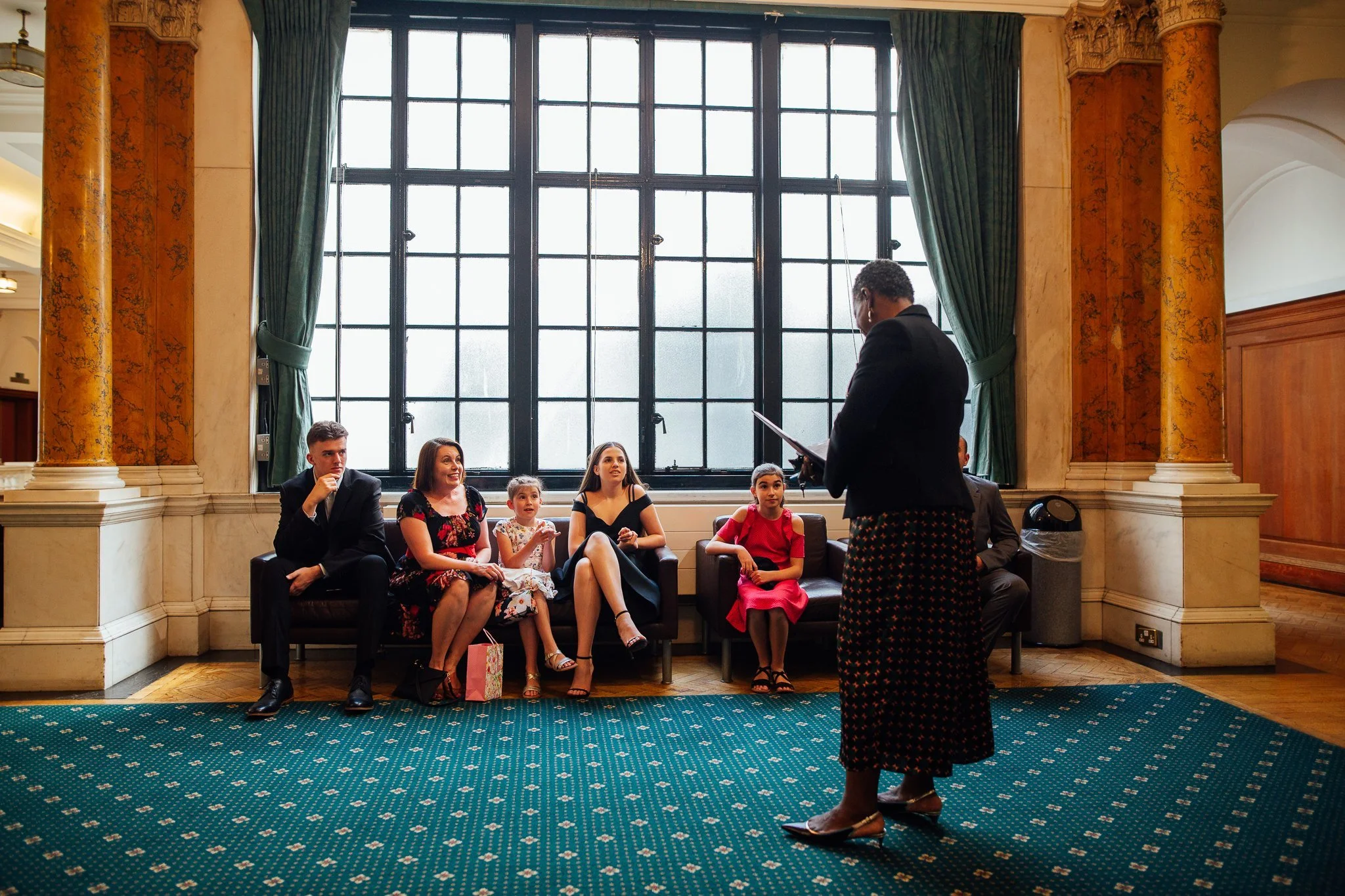  Registrar talks to the family as they wait in Camden Town Hall 