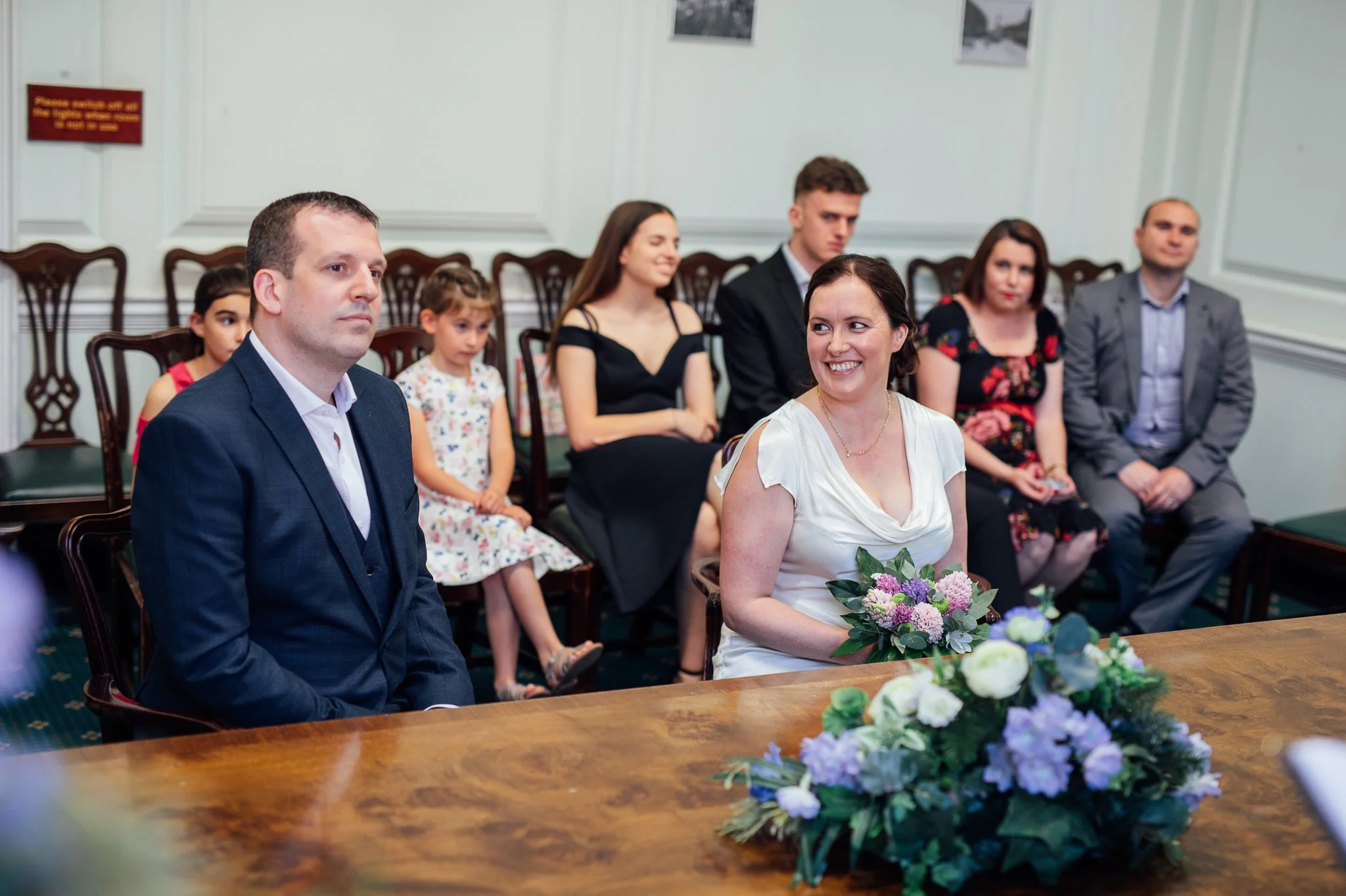  Bride smiling at the groom at Camden Town Hall 
