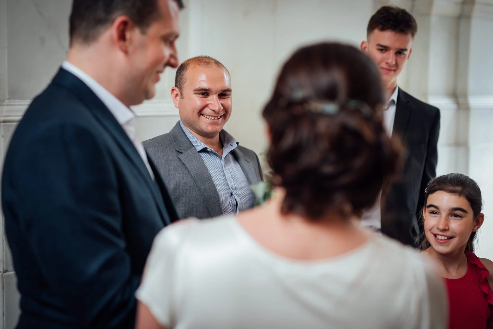  Male wedding guest smiles 