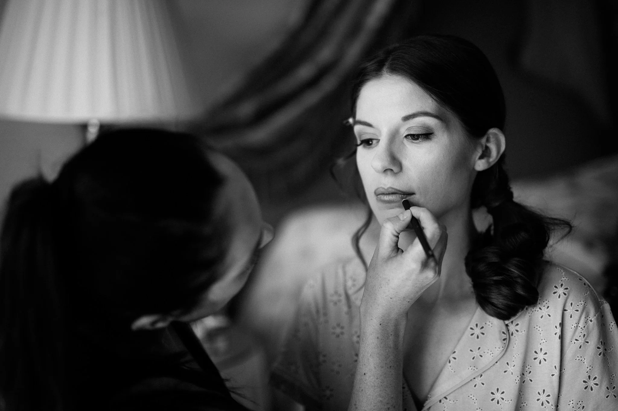  Bride has makeup applied at wadhurst castle wedding venue 