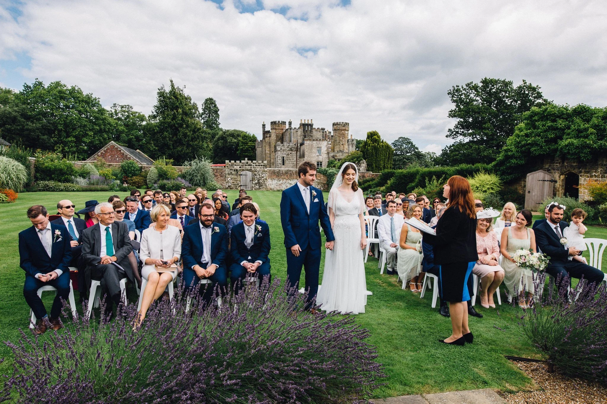 Wide angle shot of the Bride and Groom, wedding guest and  Wadhurst castle wedding venue 