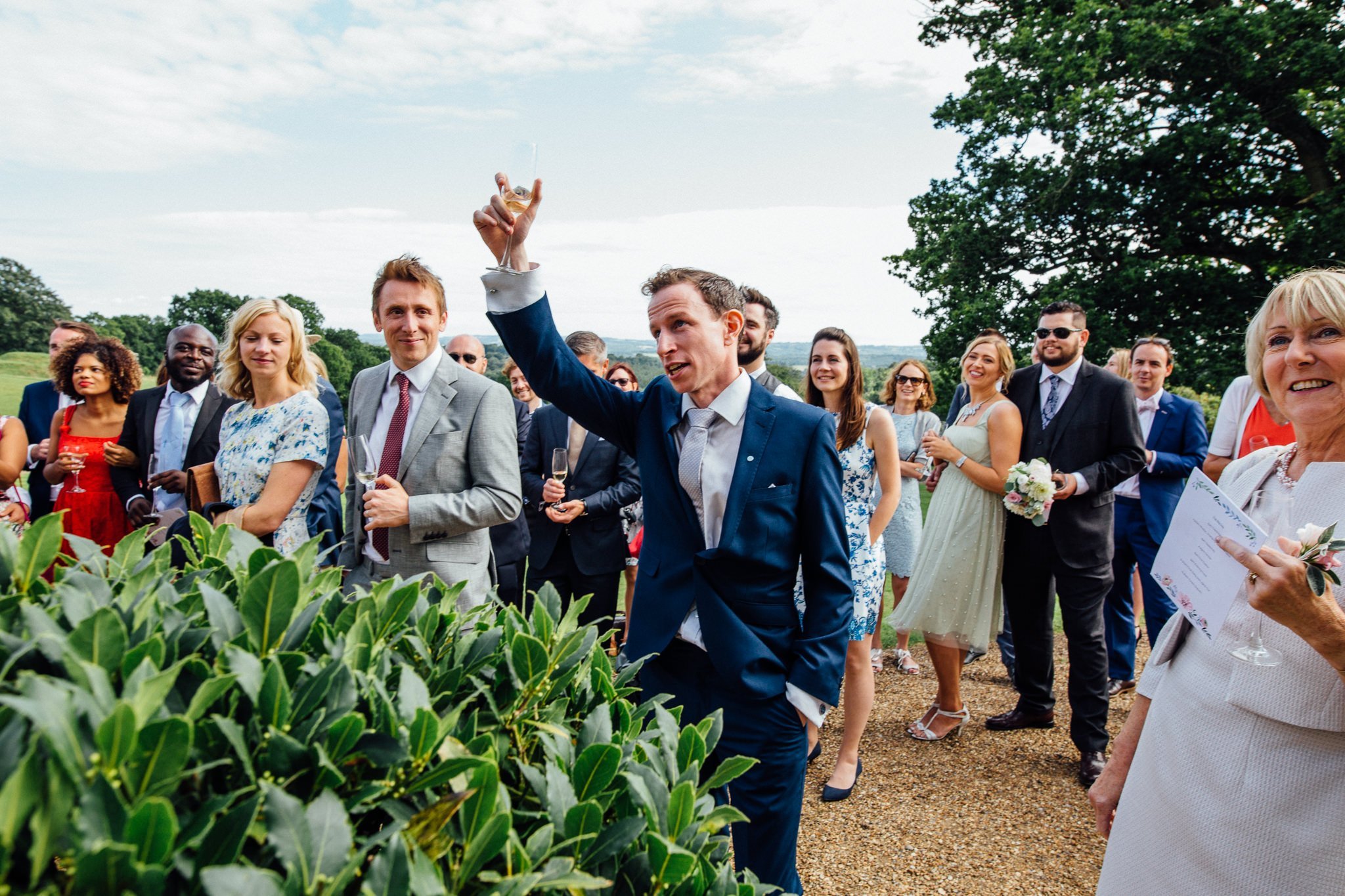  Guest raises a toast during the wedding speeches 