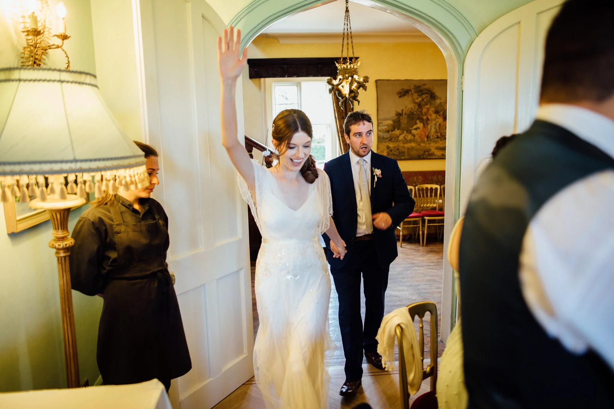  Bride and Groom are announced into the wedding breakfast at  Wadhurst castle wedding venue 