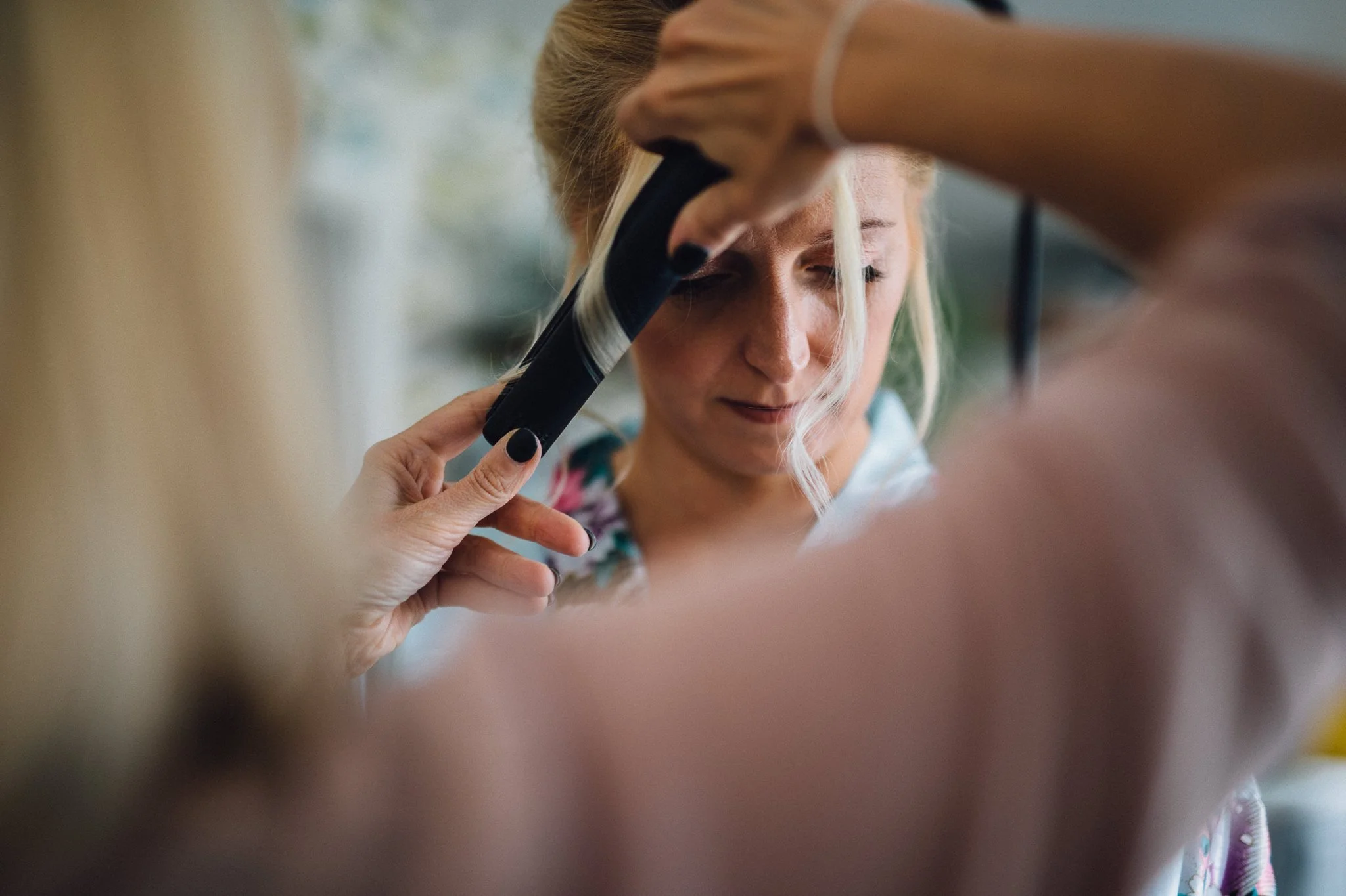  Bride has hair curled 