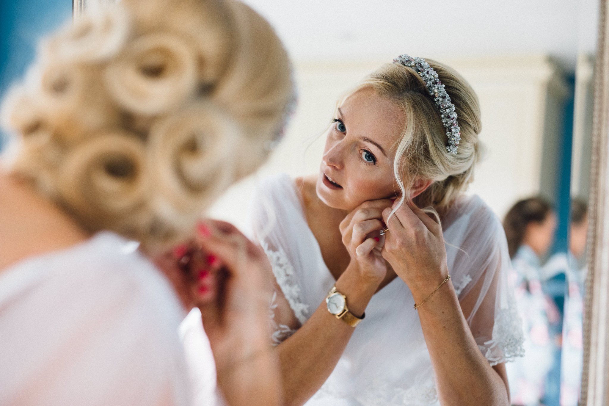  Bride putting on her earings 