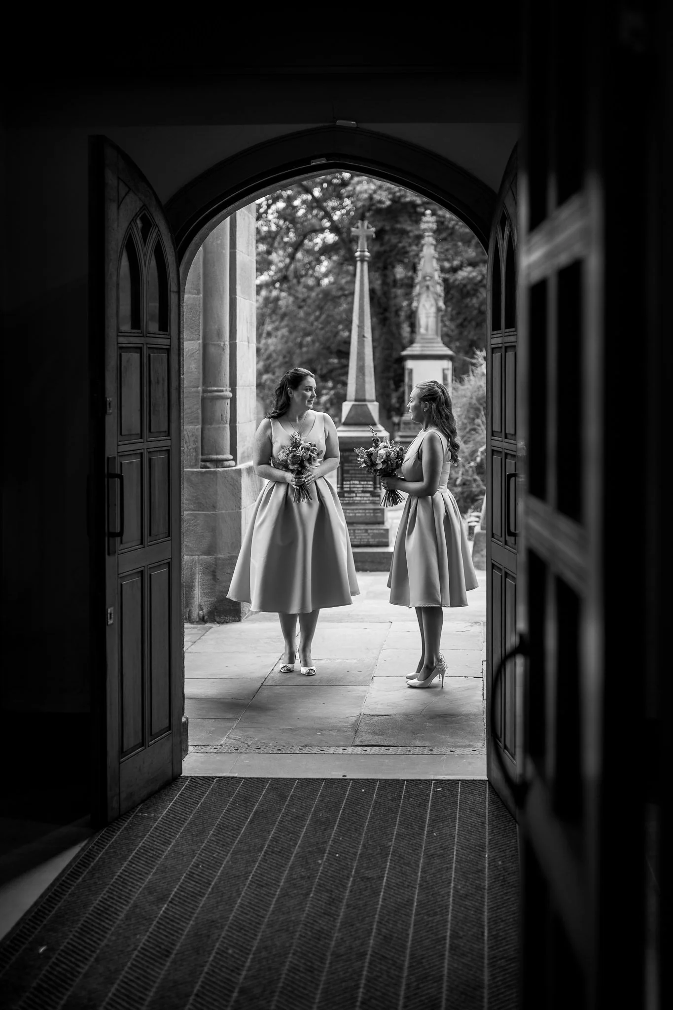  Bridesmaids wait for the Bride outside of All Saints Stand Church Whitefield 