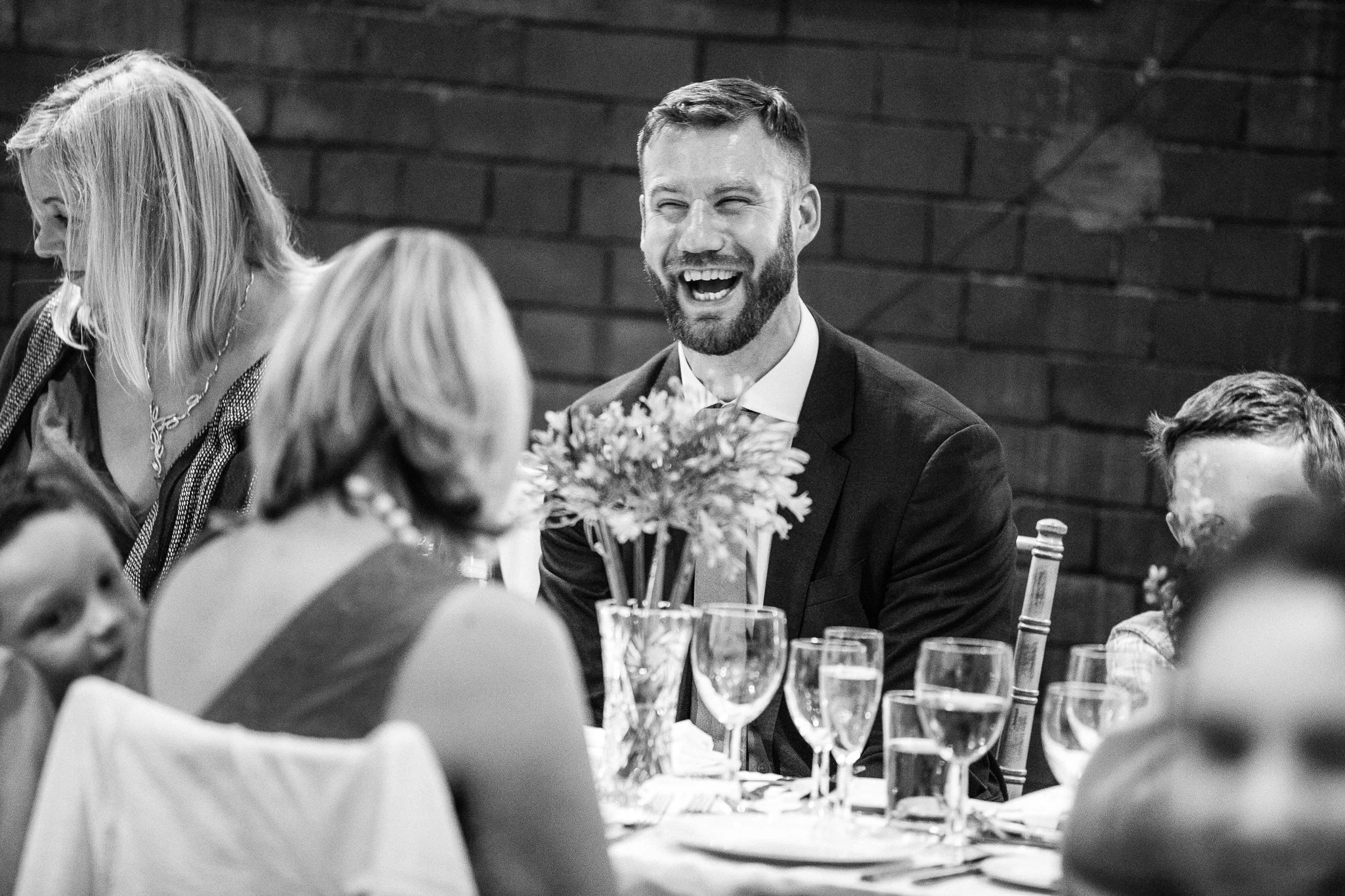  Male guest laughing at The Stables in Bury 