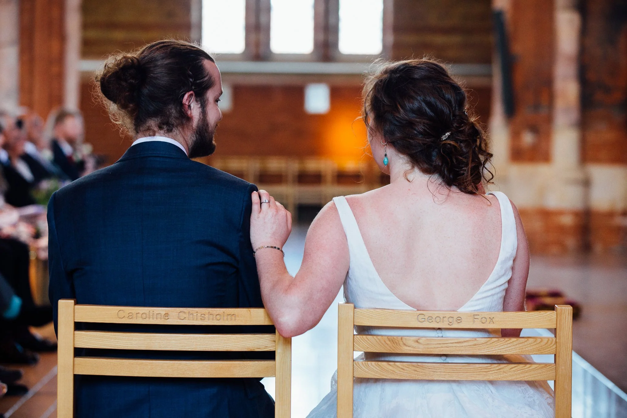  Bride puts a hand on the groom’s shoulder 