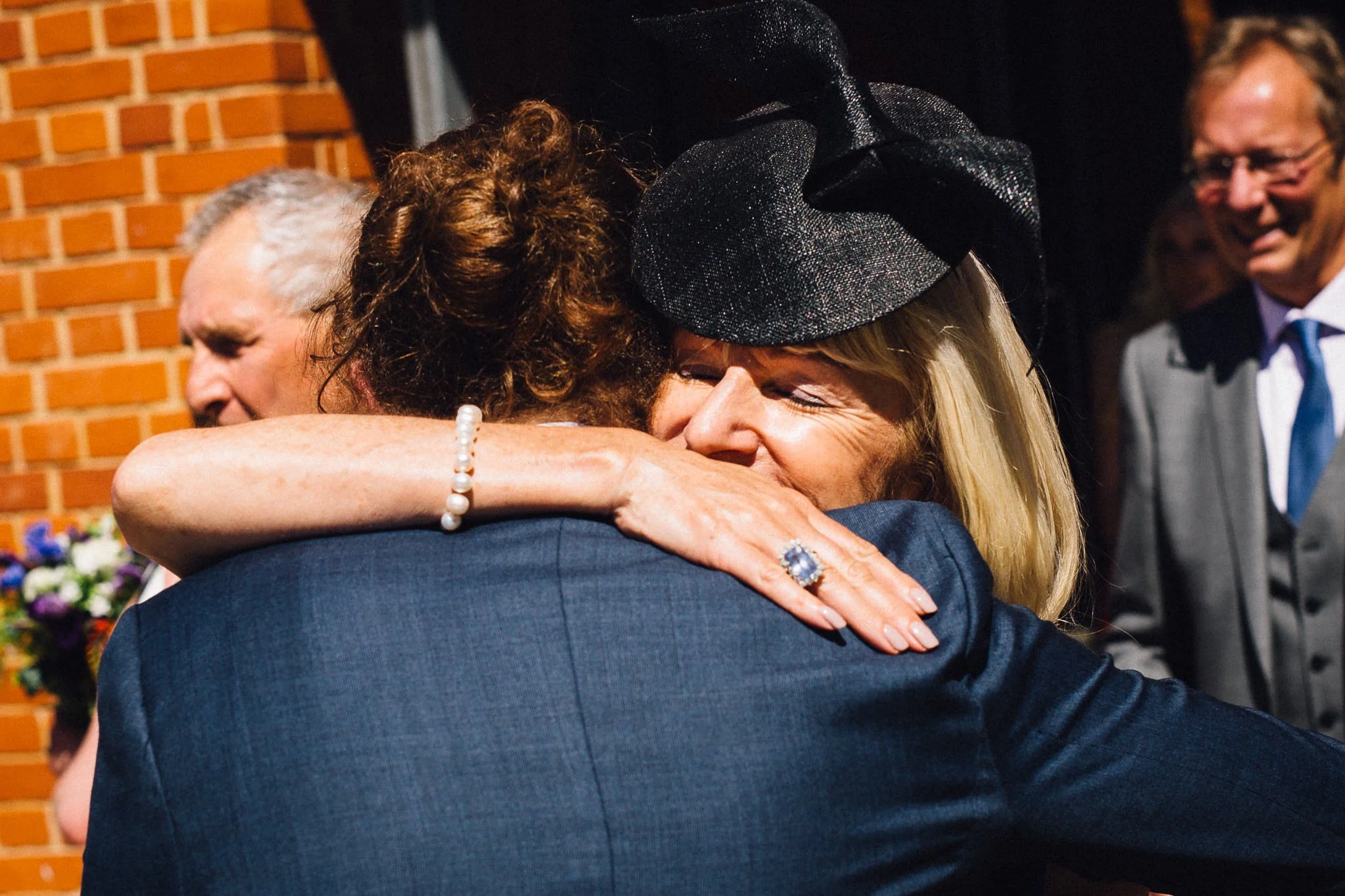  Guest hugs the groom 