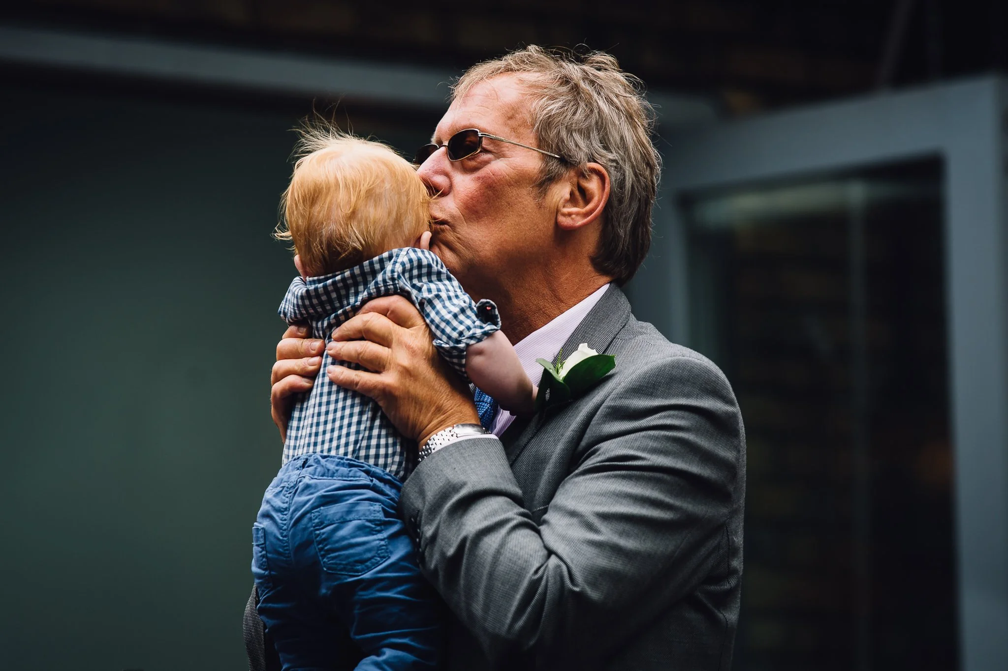  Man kisses a baby 