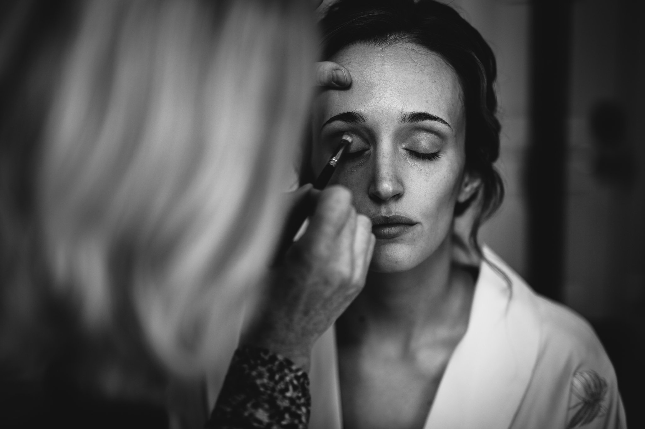  Bride has makeup applied at The Kensington Hotel 