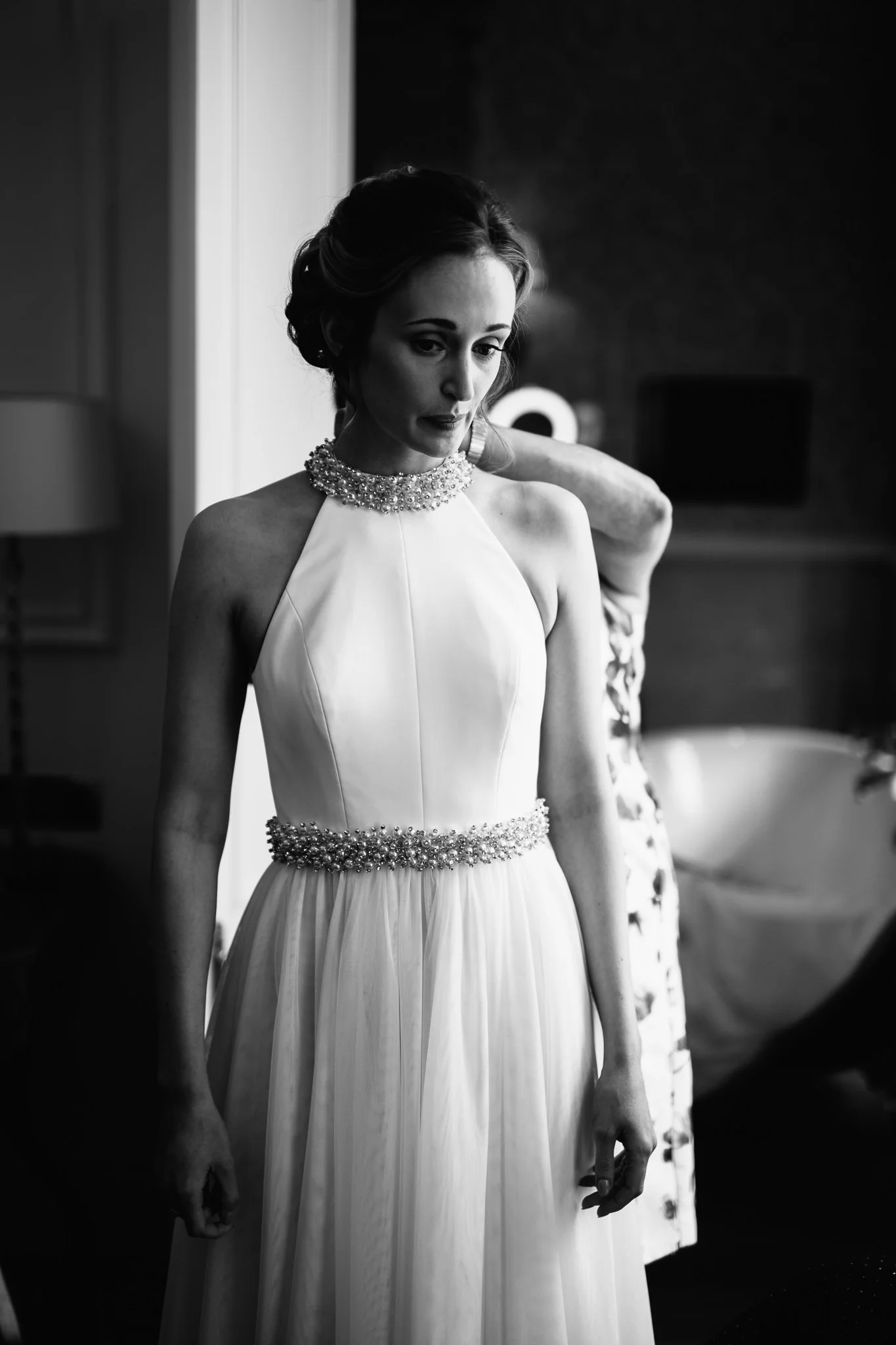  Portrait of the Bride as she gets her wedding dress on 