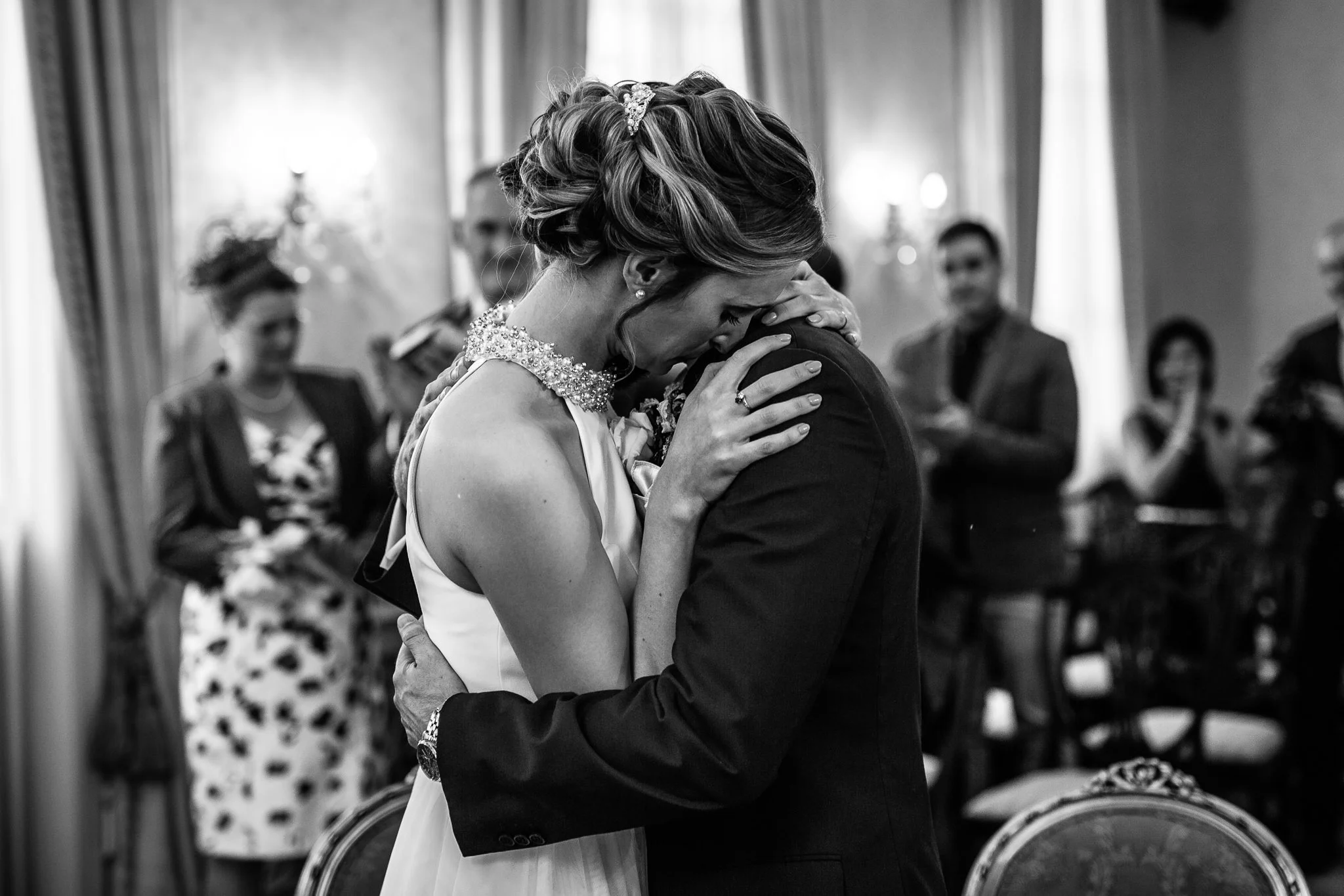  Bride and Groom embrace after being married at Chelsea Old Town Hall 