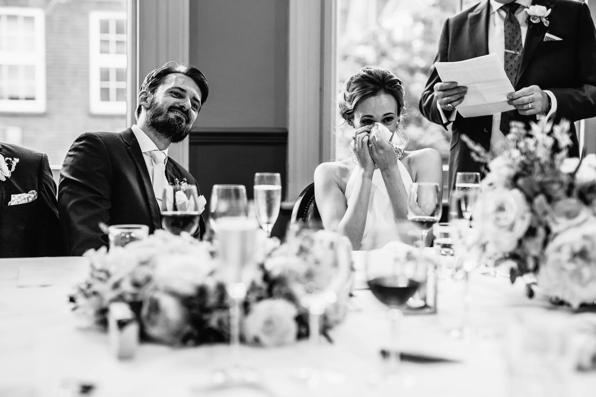  Bride wipes away a tear during the speeches 
