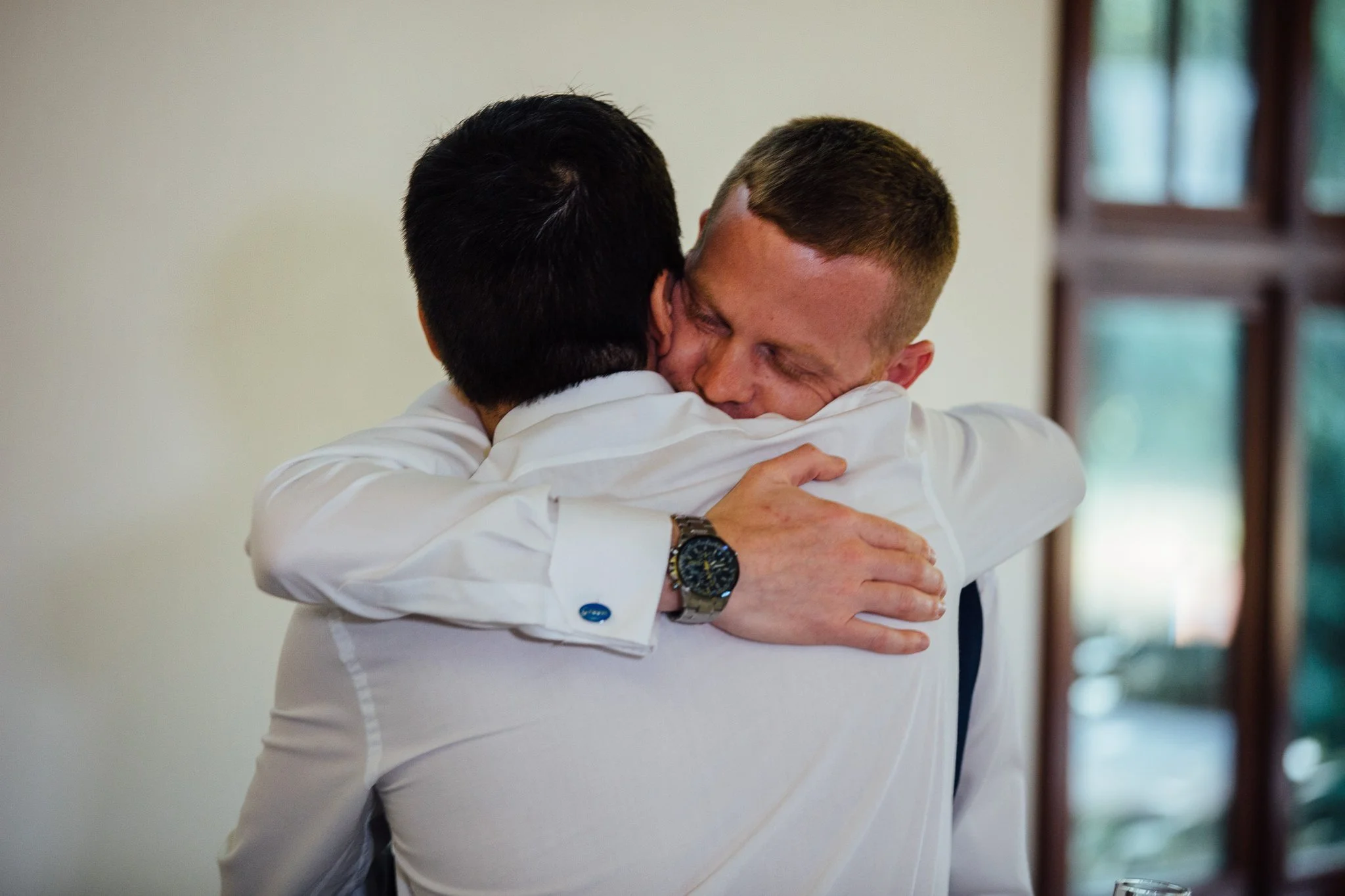  Groom hugs his friend 