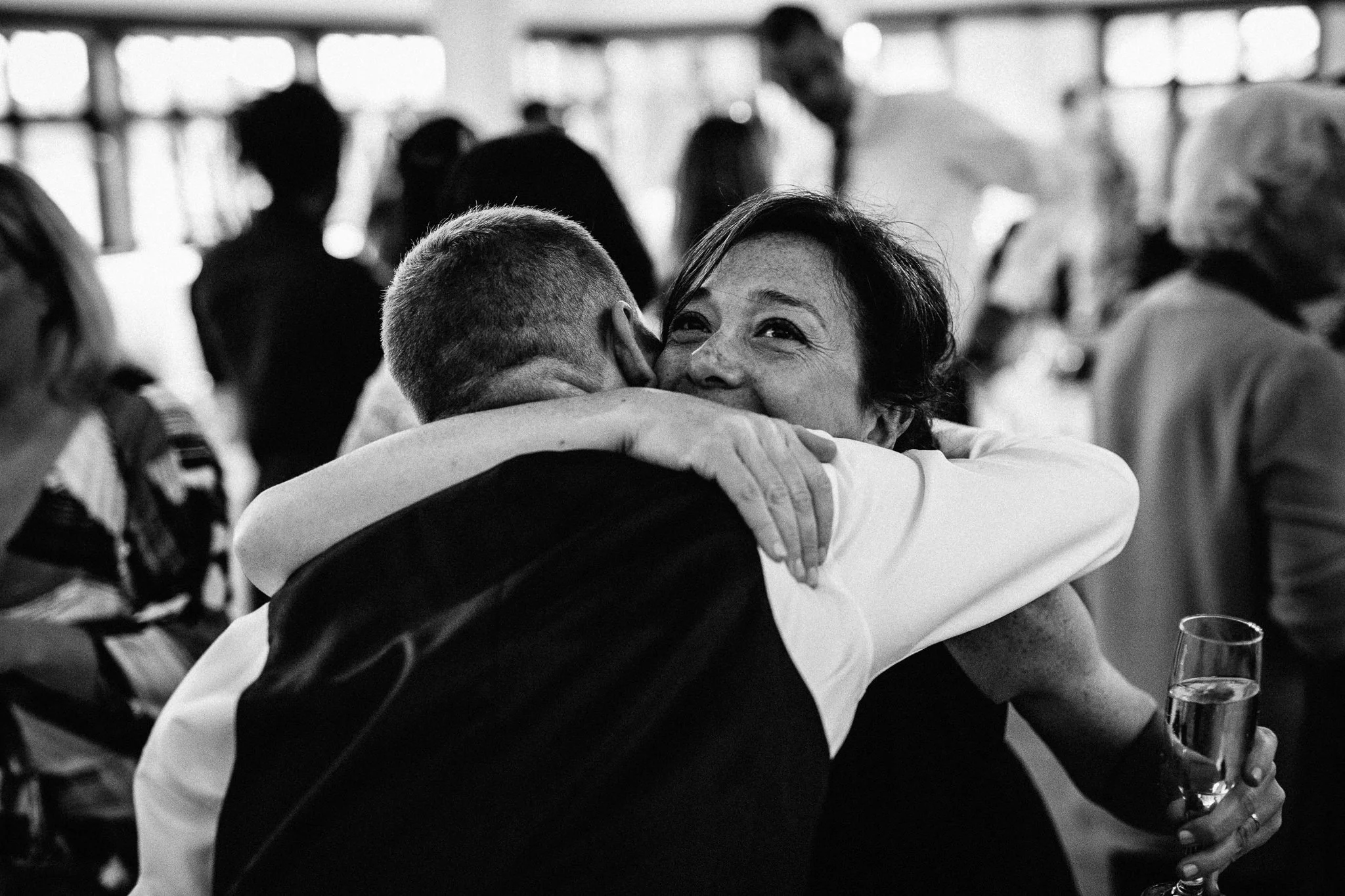  Groom hugs wedding guest 