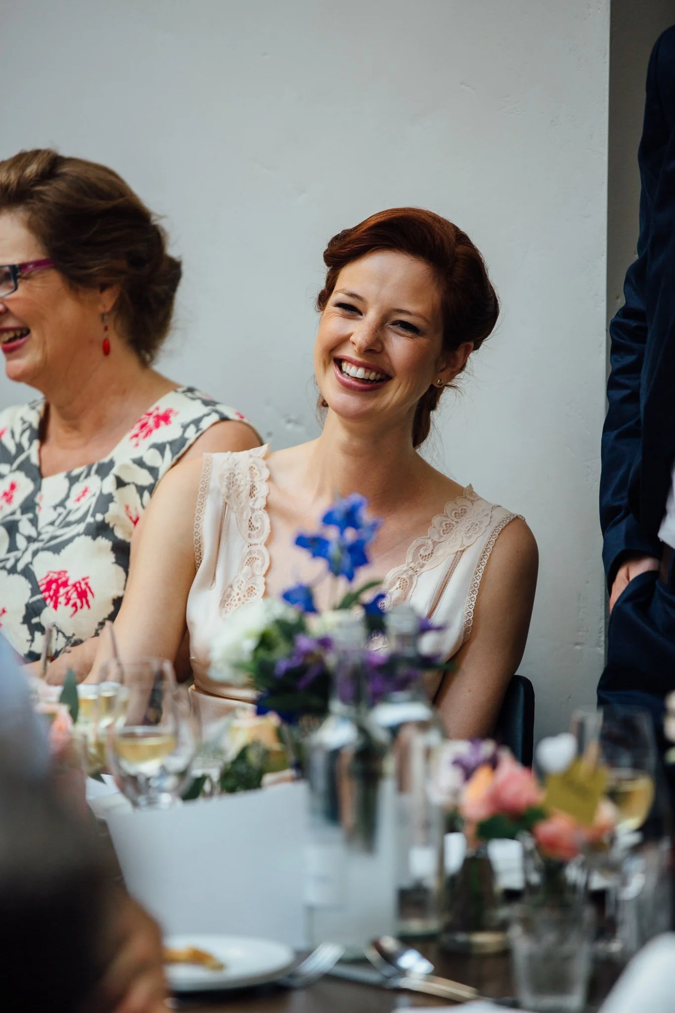  Bride smiling during speech 