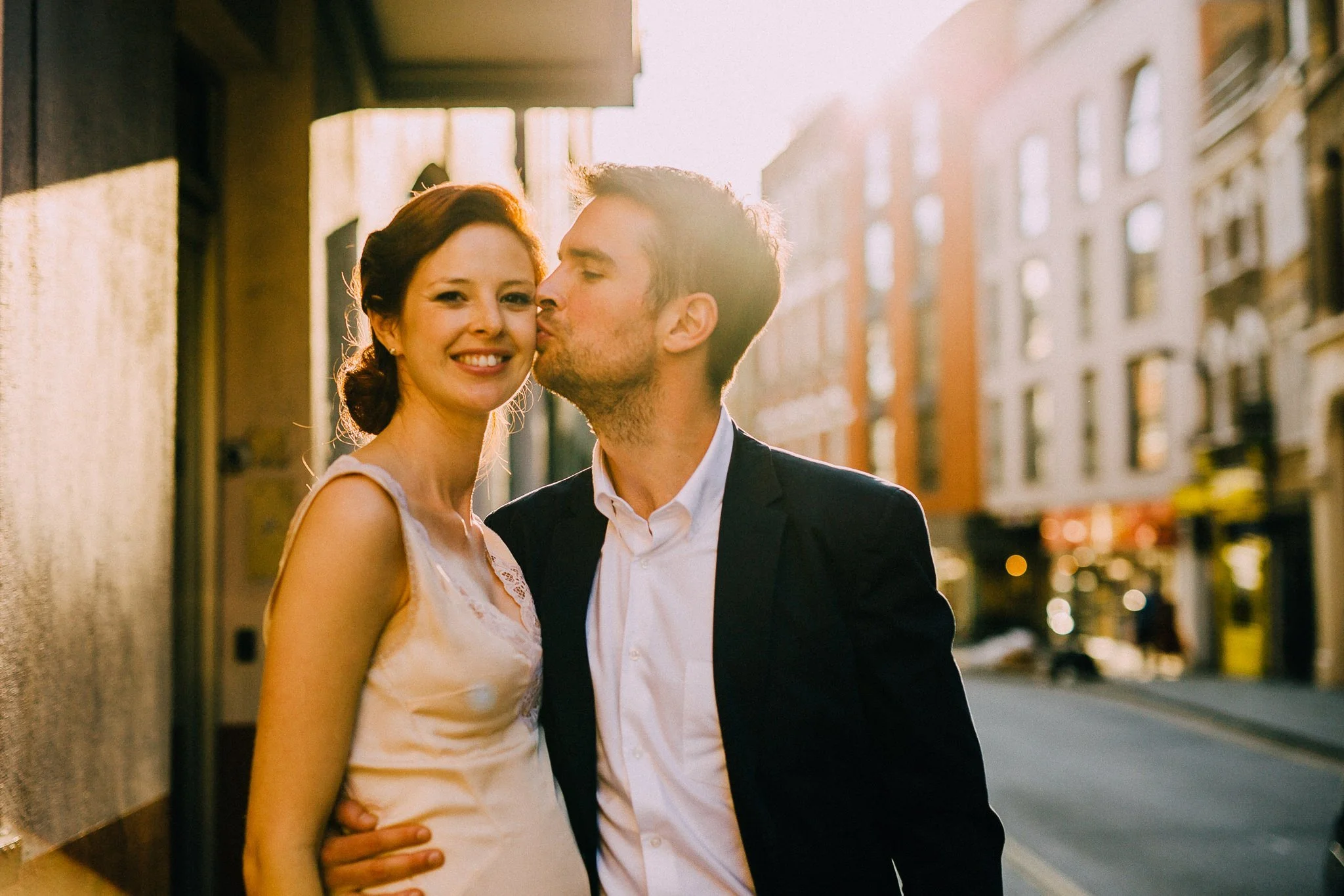  Groom kisses the Bride outside of Chelsea Old Town Hall 