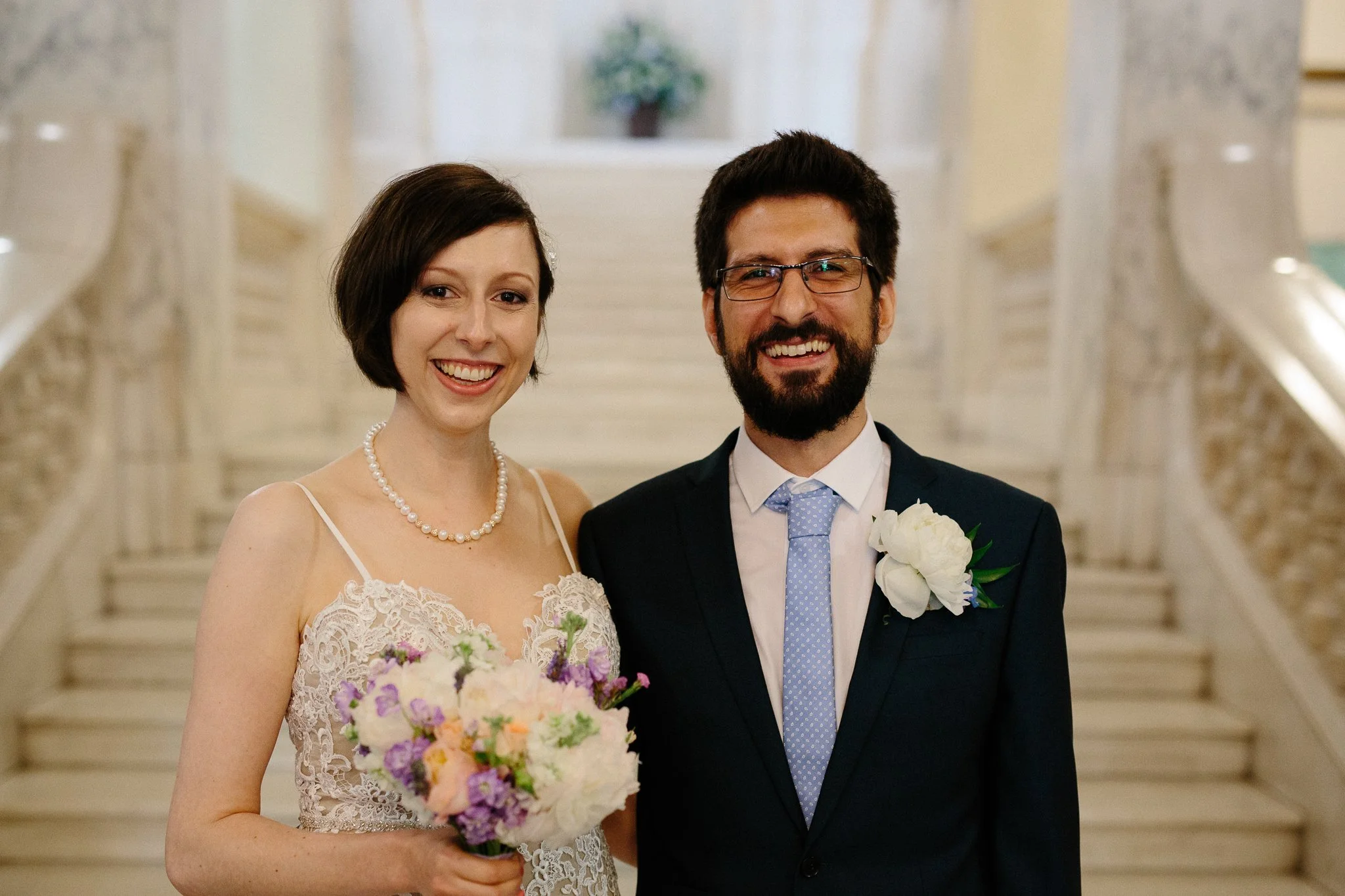  Bride and Groom posing for a portrait in Camden Town Hall 