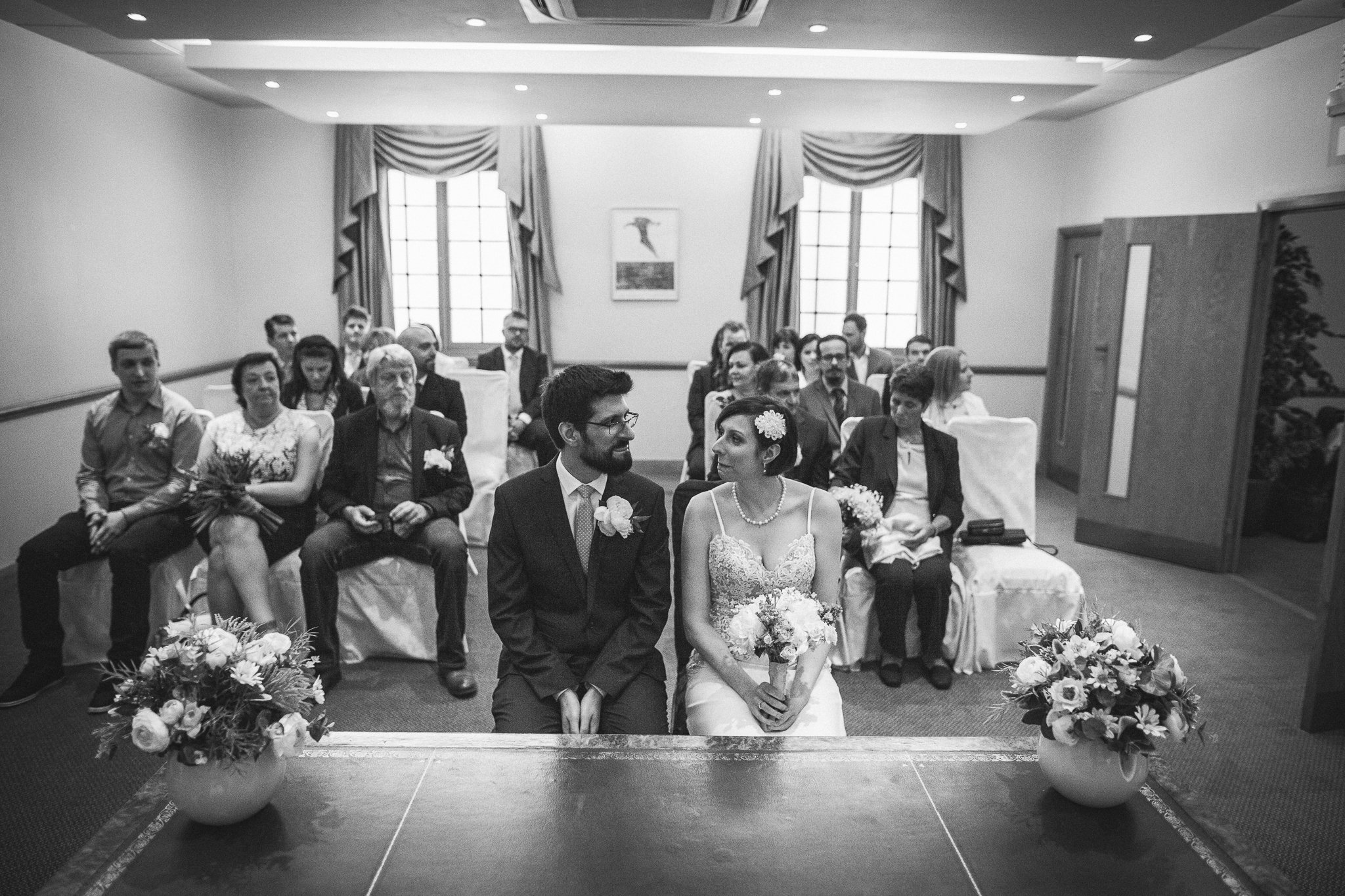  Bride and Groom sitting down in a ceremony room at Camden Town Hall 