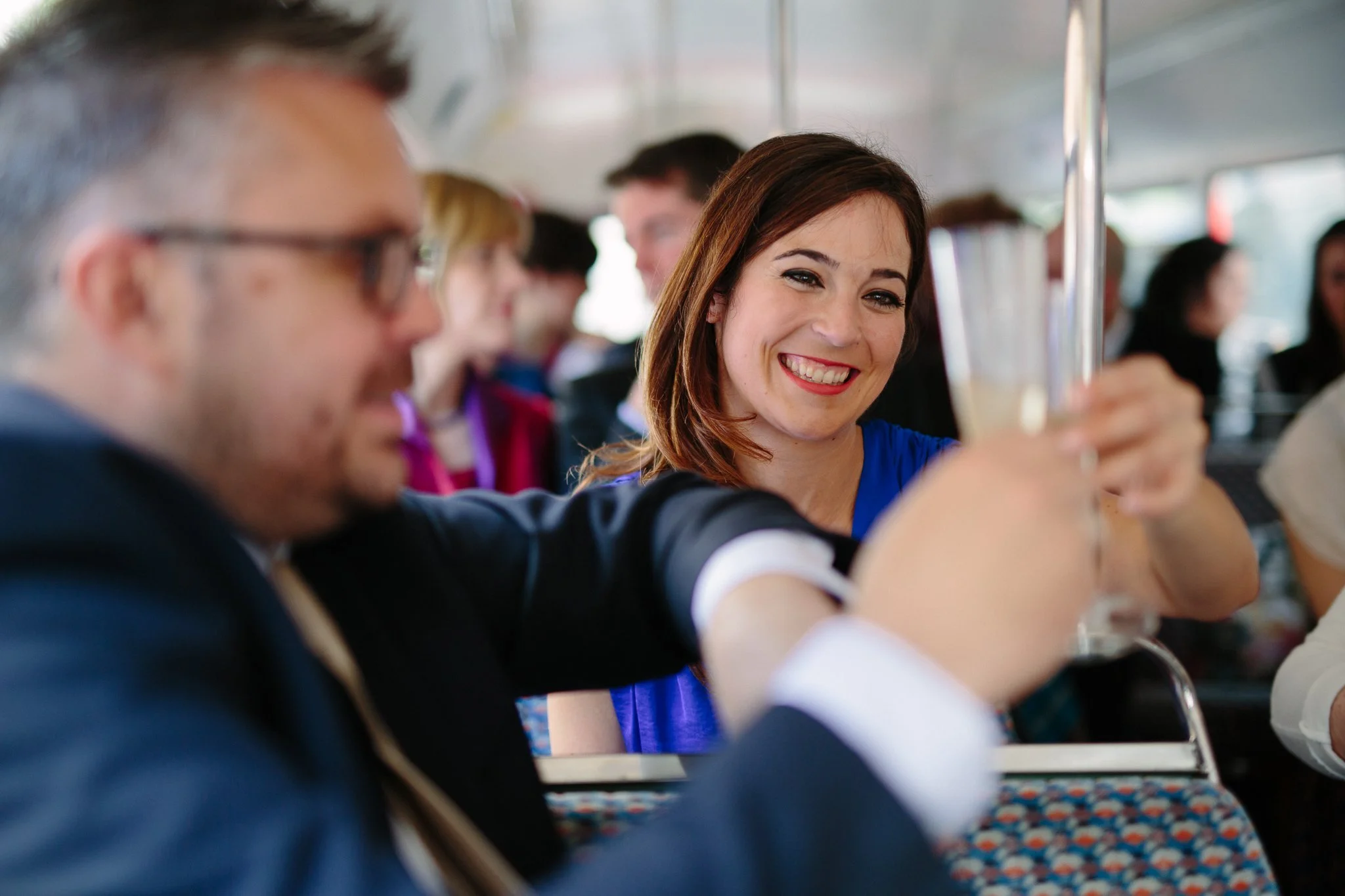  Wedding guest smiling at friend 