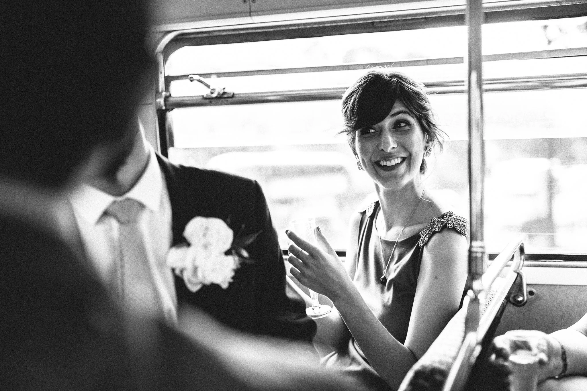  The sister of the Groom smiles on the wedding bus 