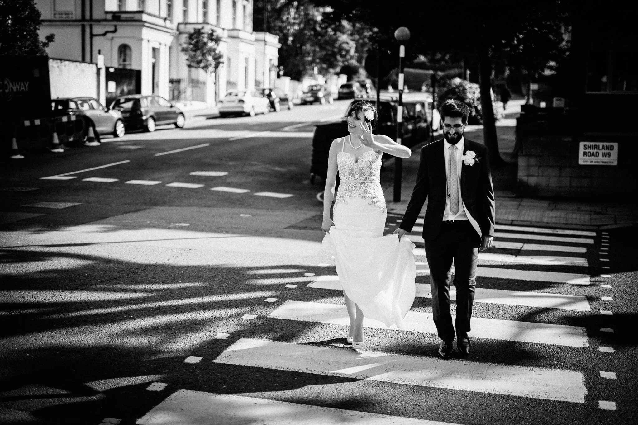  Bride and Groom cross the road at a zebra crossing in Maida Vale 