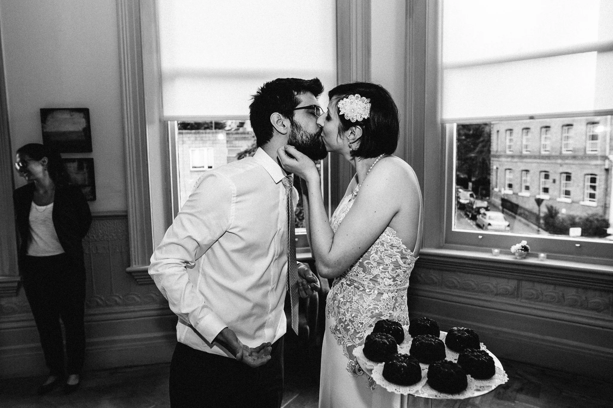  Bride and Groom kissing after cutting the cake. 
