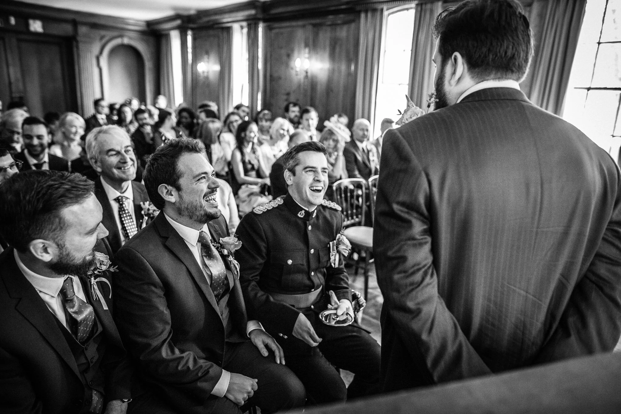  Groomsmen laughing at burgh house hampstead 