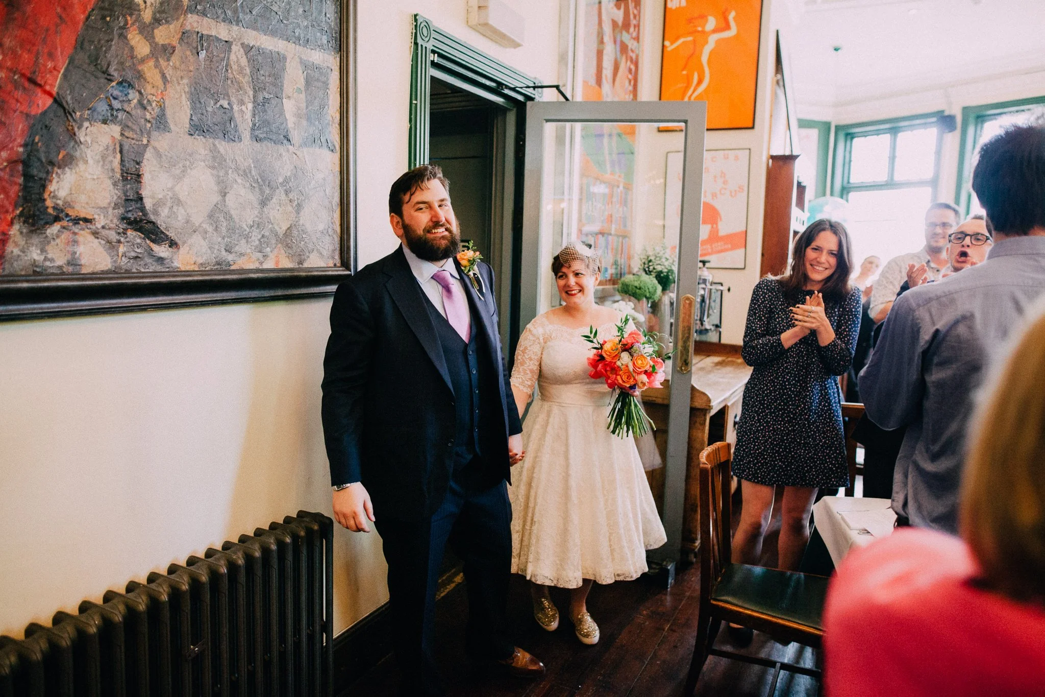  Bride and groom our announced into the room for the wedding breakfast  