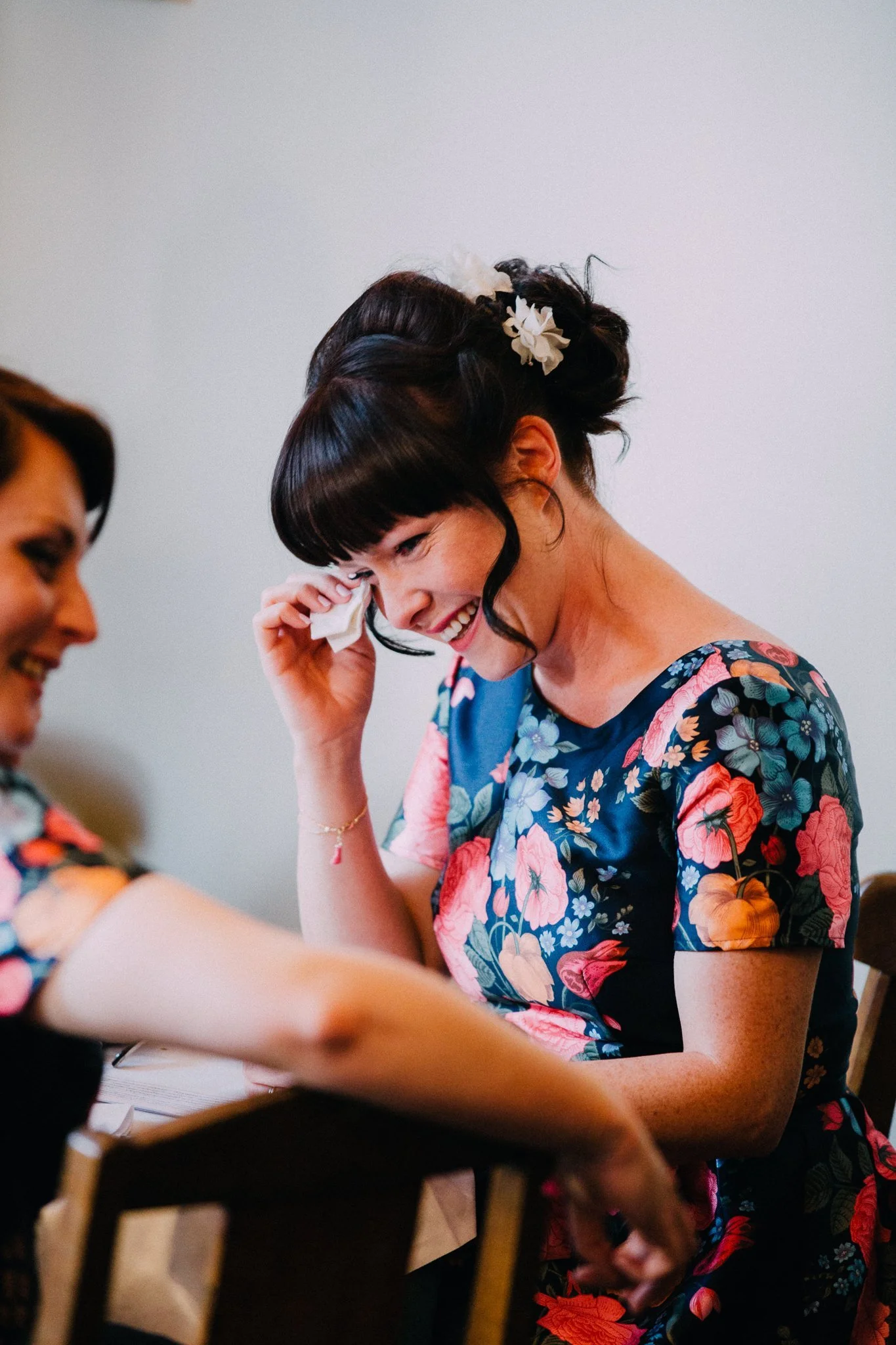  Bridesmaid wipes away a tear during the speeches 