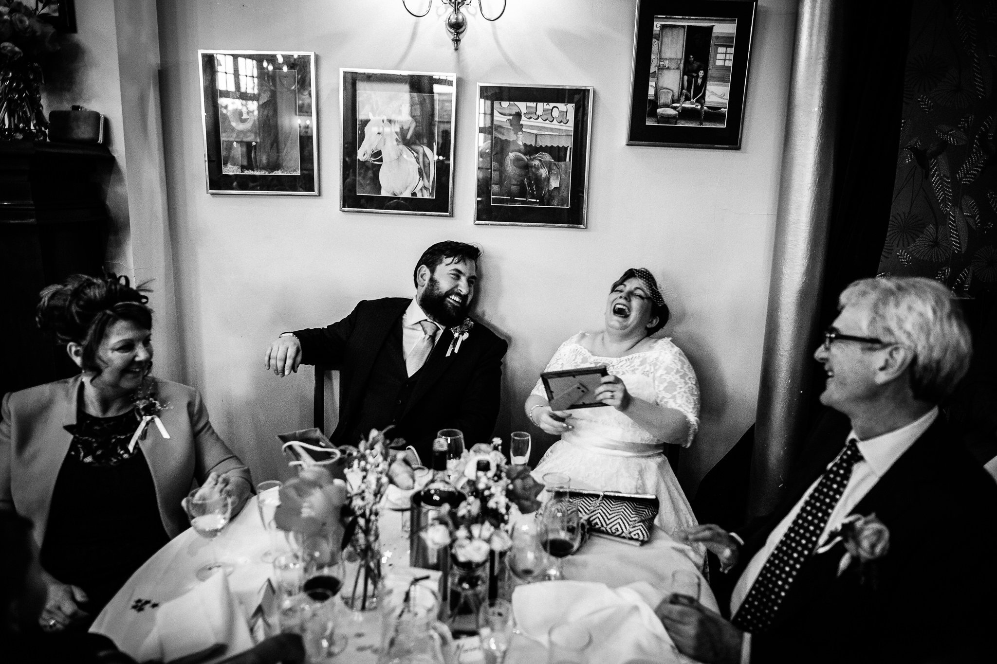  Bride and Groom laughing during speeches 