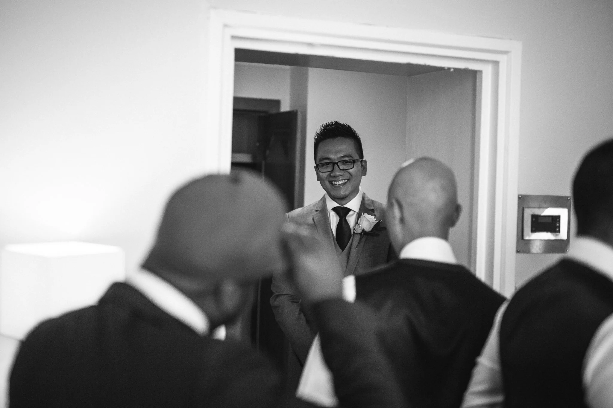  Groom smile in front of his best men 