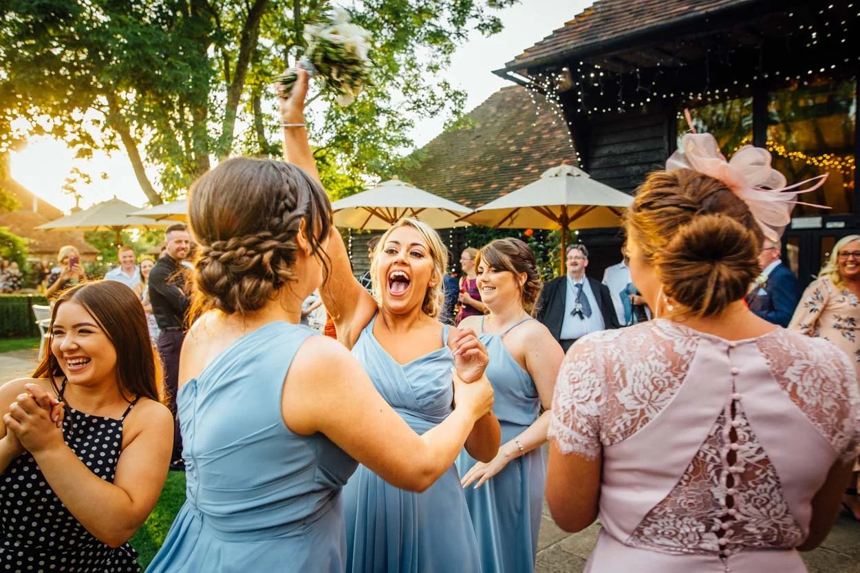 bridesmaids in pale blue laughing