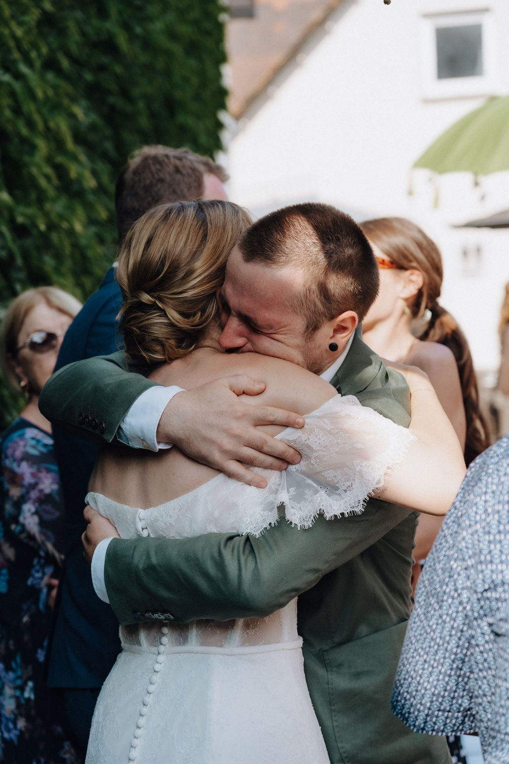 Emotional moment between wedding guest and bride by wedding photographer Jessica Di Salvo.