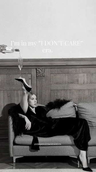 Woman lounging on a sofa with a tap pouring water into her head, and text on the wall saying 'I'm in my 'I DON'T CARE' era'.