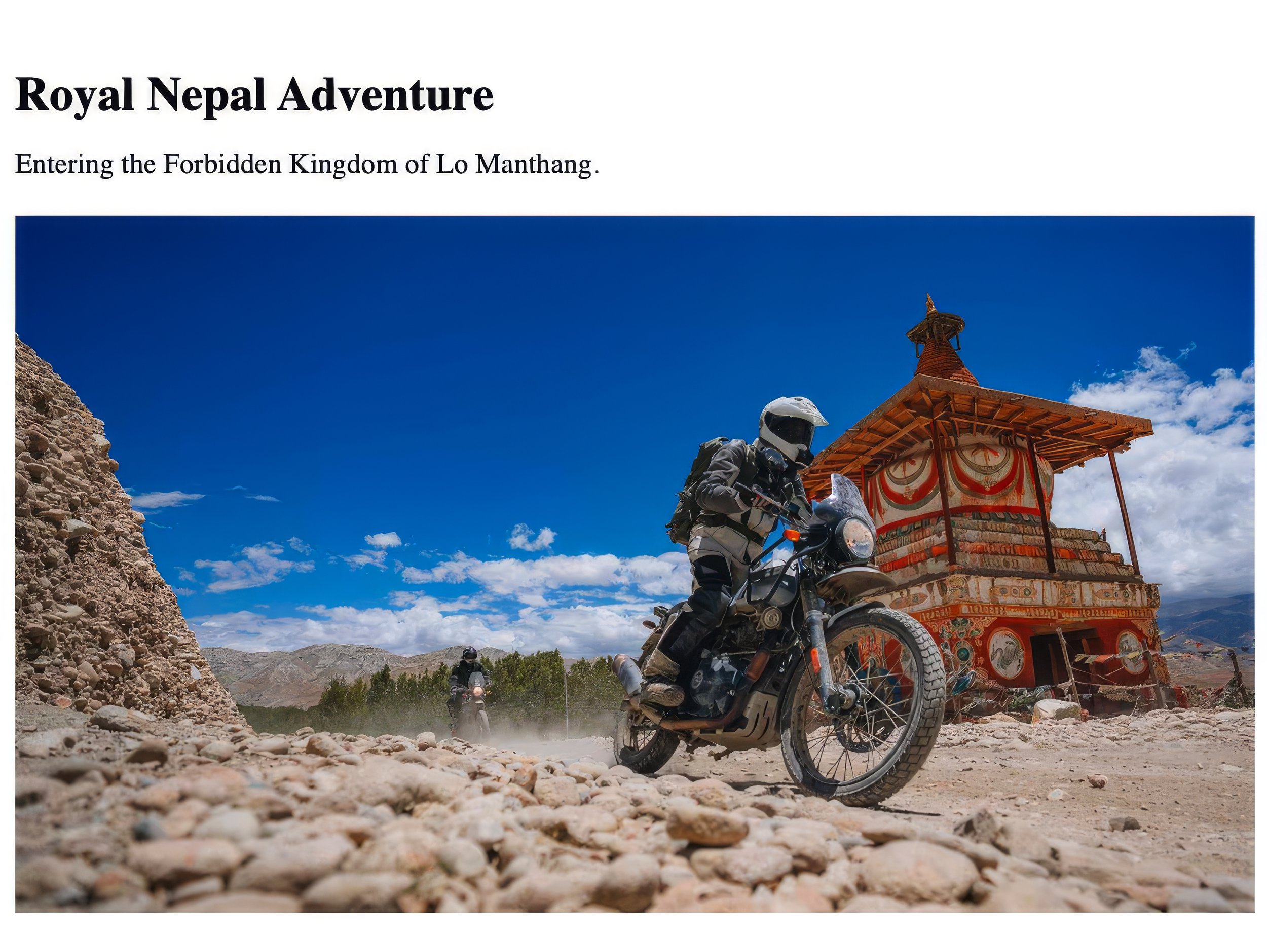 Motorcycles riding on rocky dirt trail near a traditional Nepalese chorten with a clear blue sky.