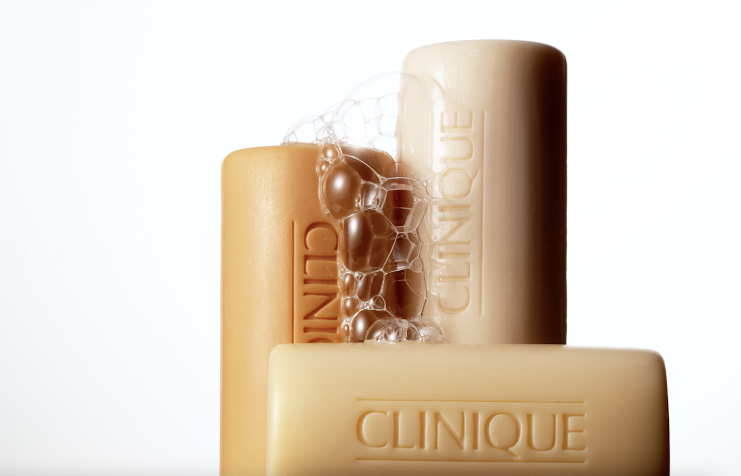 Image of 2 bars of the iconic, orange bar soap from clinique stacked in an aesthetically pleasing way.