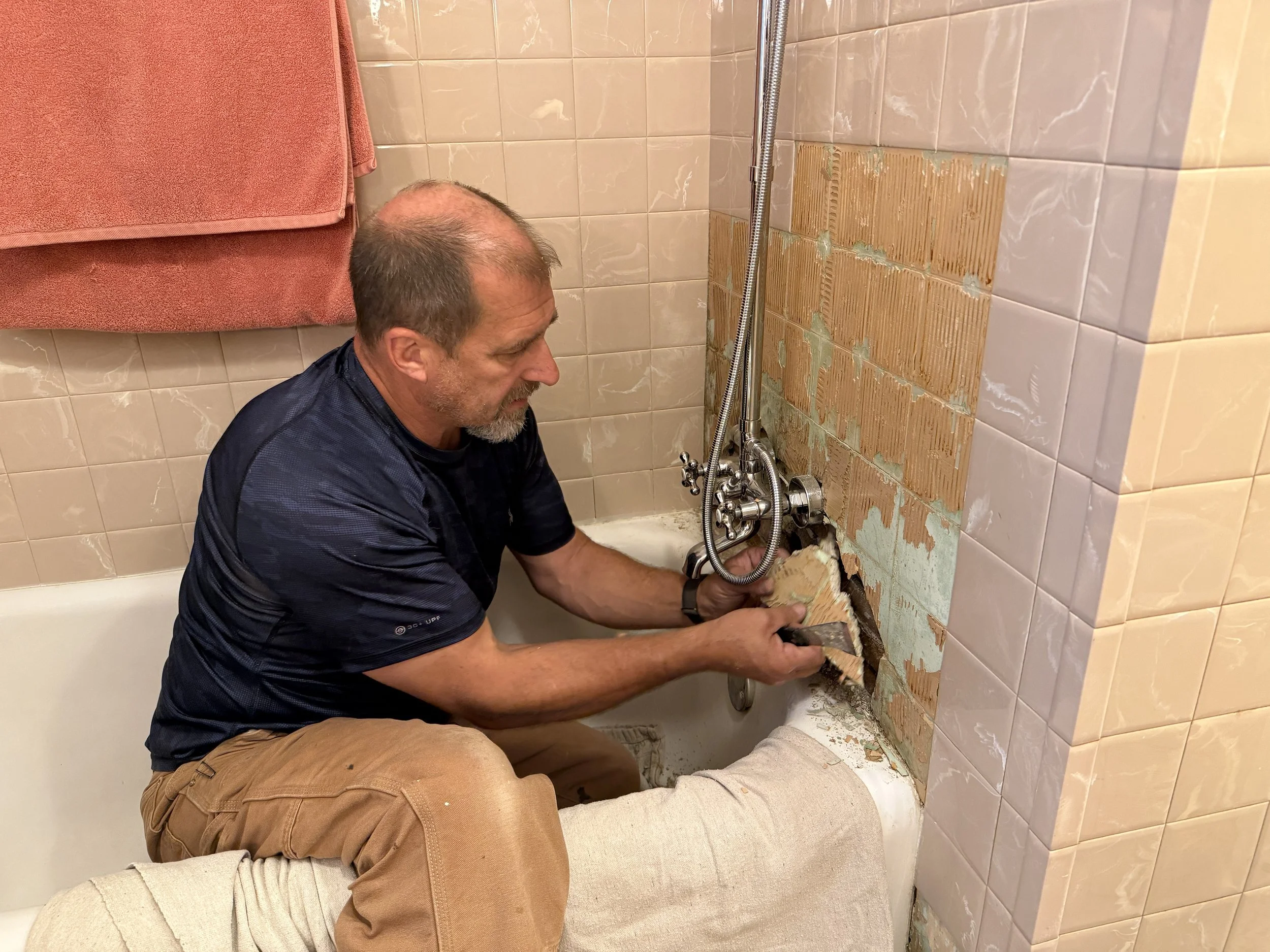 Daryl working on a bathroom