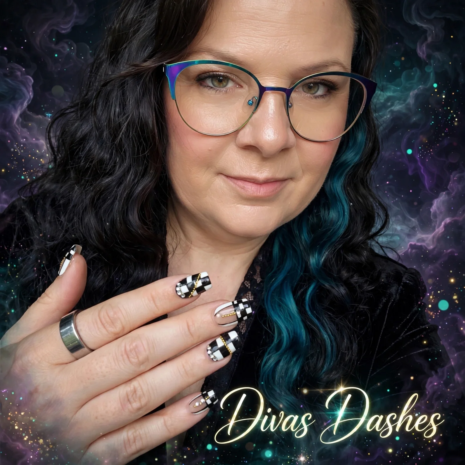 Close-up of a woman with black hair with a streak of blue, wearing glasses, showing her hand with decorated nails and rings, and the text "Diva Dashes" at the bottom, with a cosmic background.