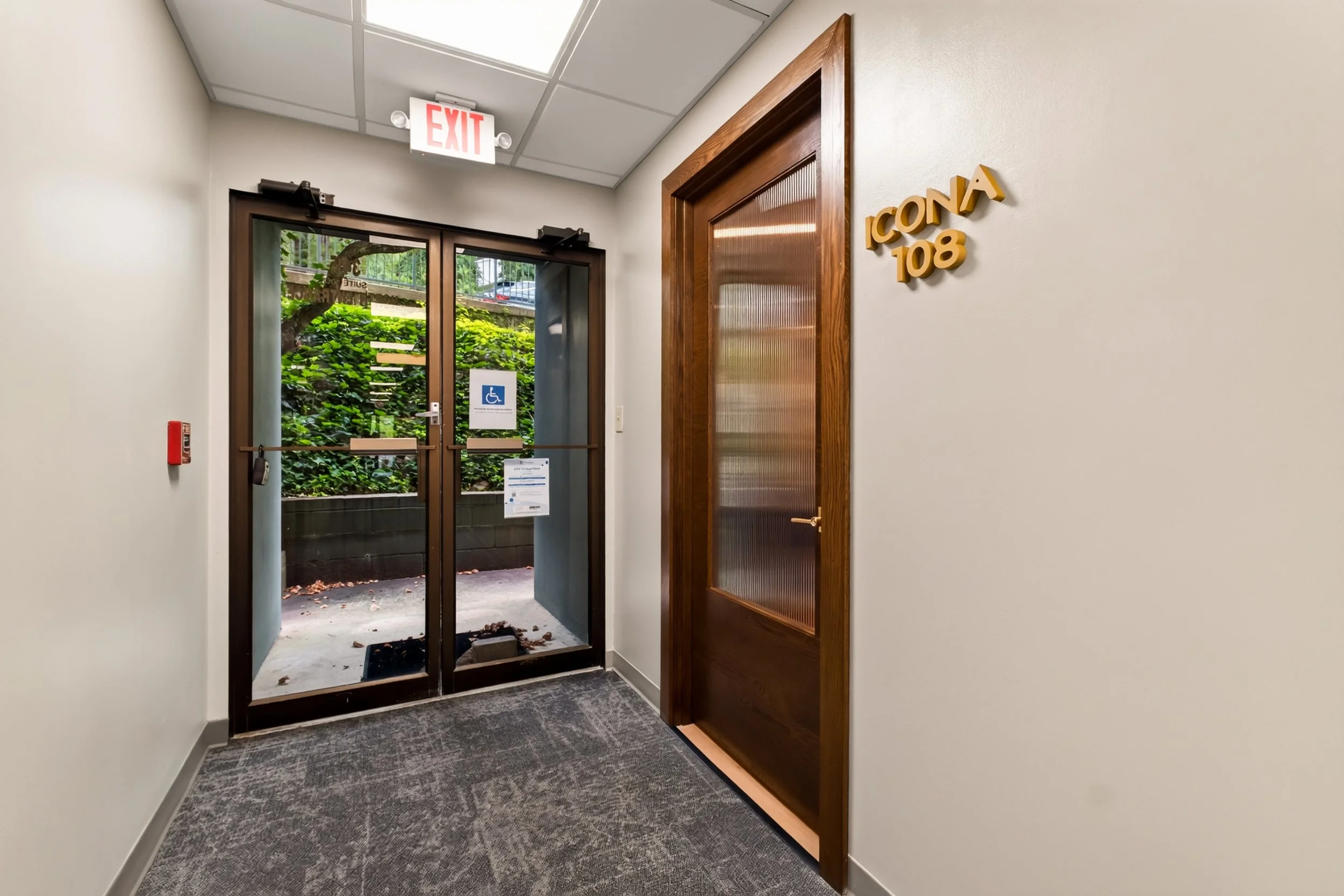 This hormone health and wellness practice is located within a professional office building in Homewood received a full interior renovation. Standout features include white oak custom millwork and a custom reeded-glass front door. Architect and Interi