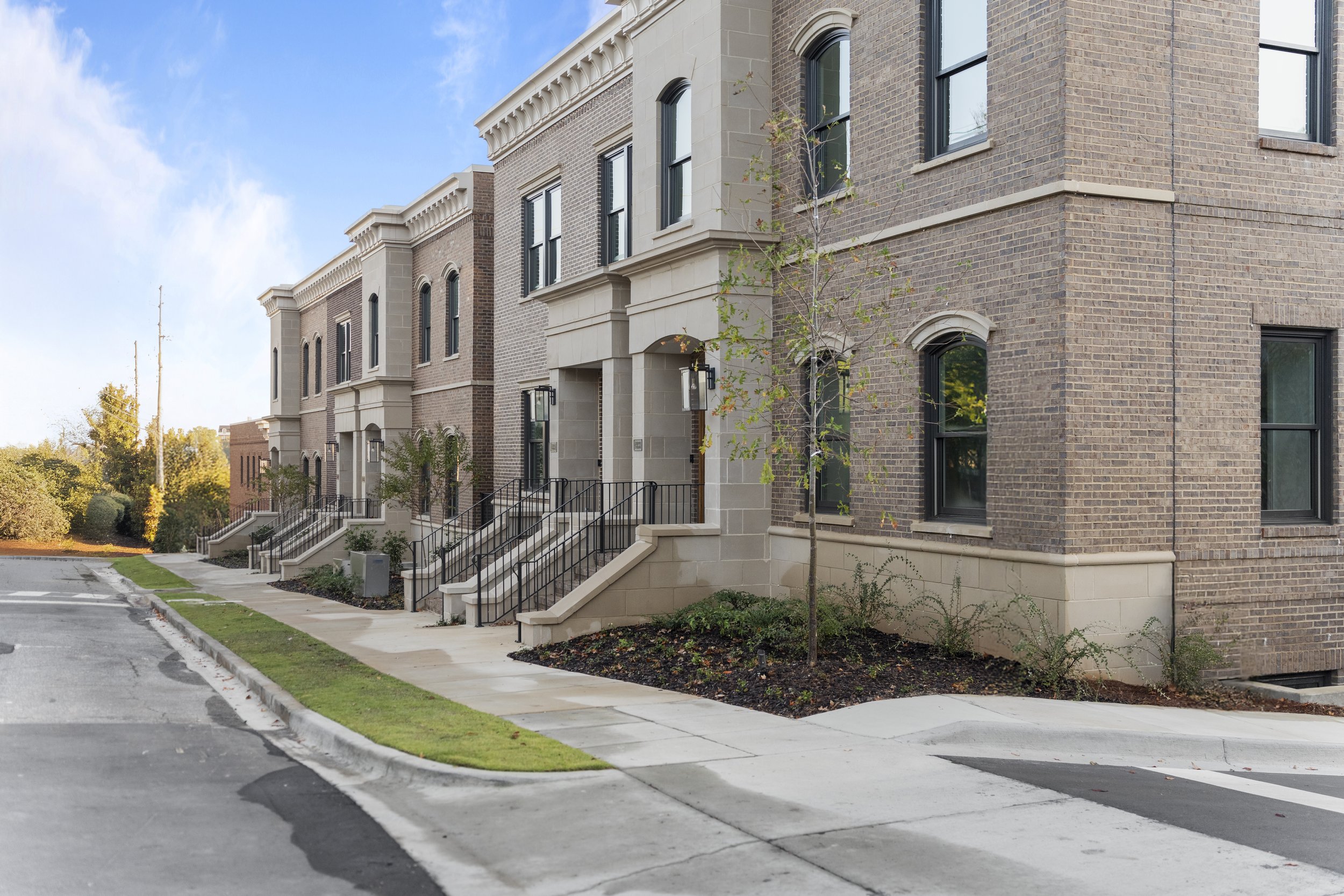 Inspired by the historic brownstones of New York, this urban Birmingham development brings together five individual buildings and 11 residences. With a tight one-acre site and challenging soil conditions requiring the excavation and replacement of ap
