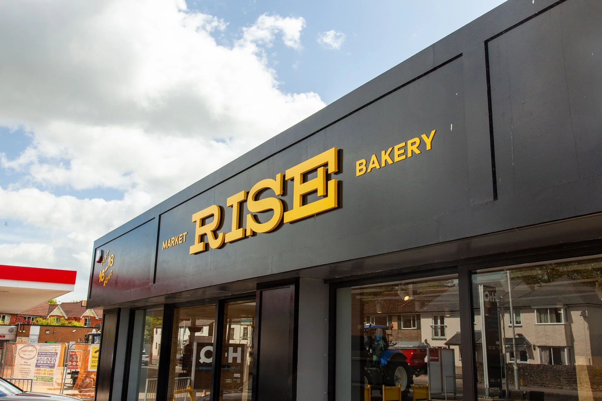 Exterior view of a bakery with yellow signage reading "BISTE" and