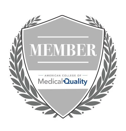 Medal or badge with a shield and laurel wreath, featuring the words 'MEMBER' and 'American College of Medical Quality'.