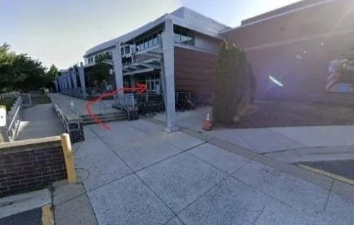 The covered entrance doors of the aquatic center