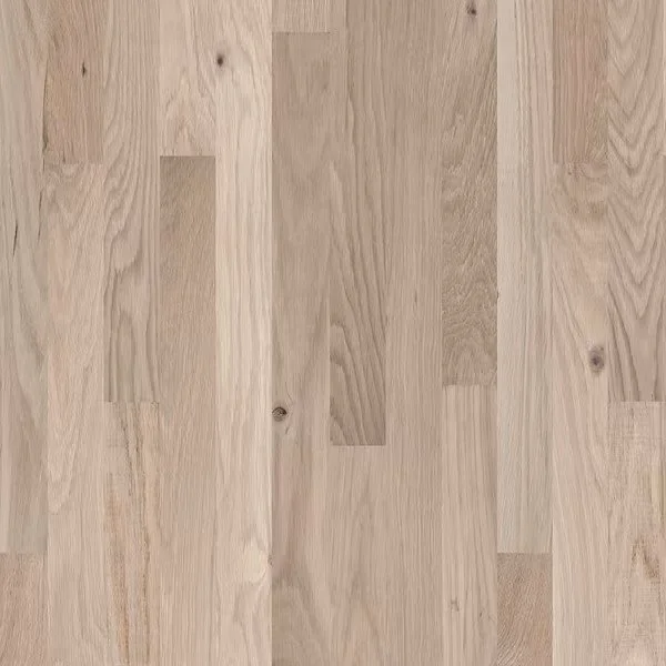 Close-up of a light-colored wooden floor with natural grain and knots.