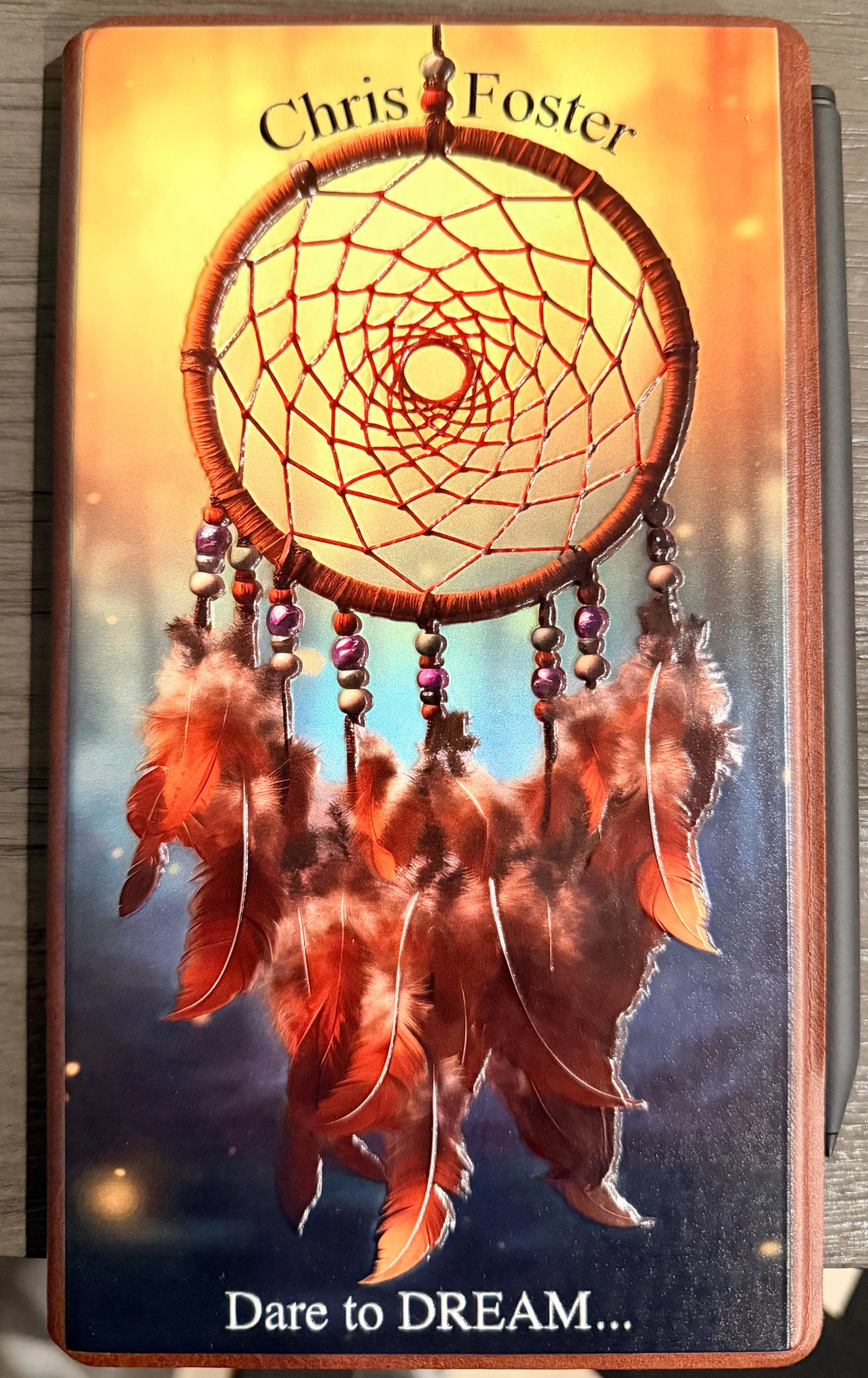 Carry your inspiration — a custom tablet cover with colorful dreamcatcher artwork.