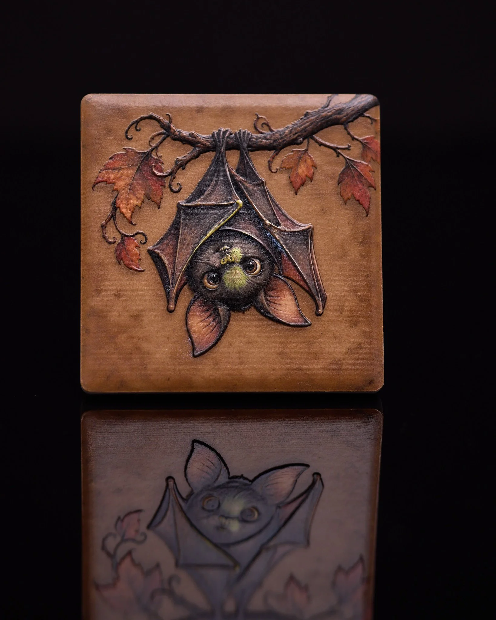 A little Halloween charm — playful bat artwork on a decorative magnet.