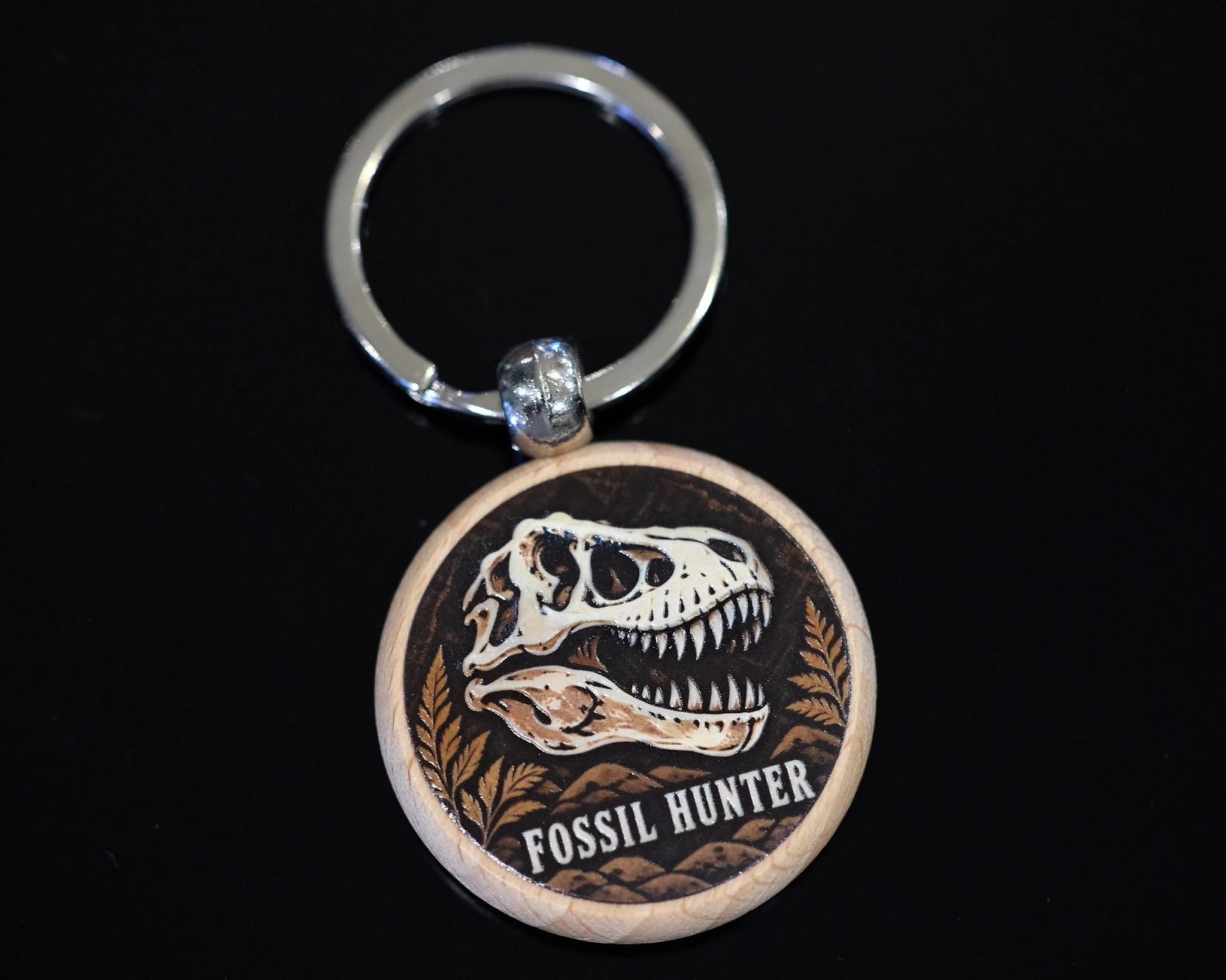 Fossil Hunter — illustrated wood keychain. A little adventure to carry every day.
